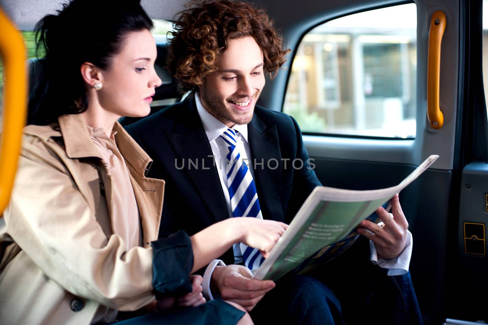 Corporates discussing finances published in newspaper by stockyimages