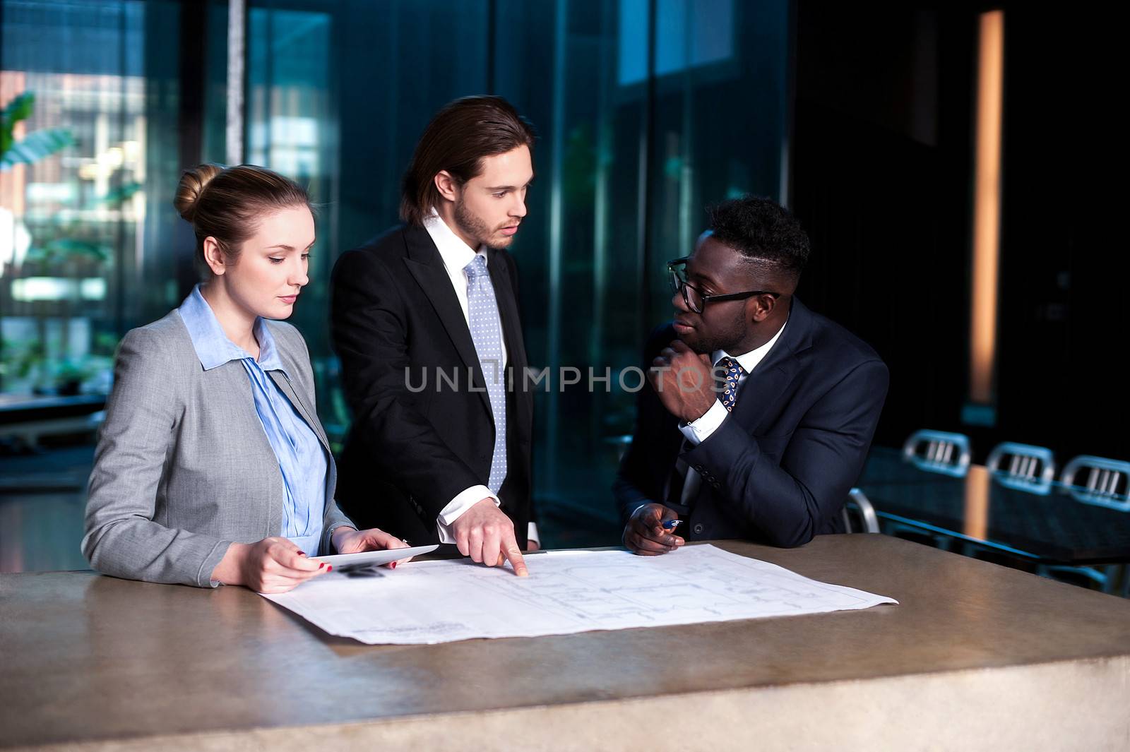 Business team working on a project by stockyimages