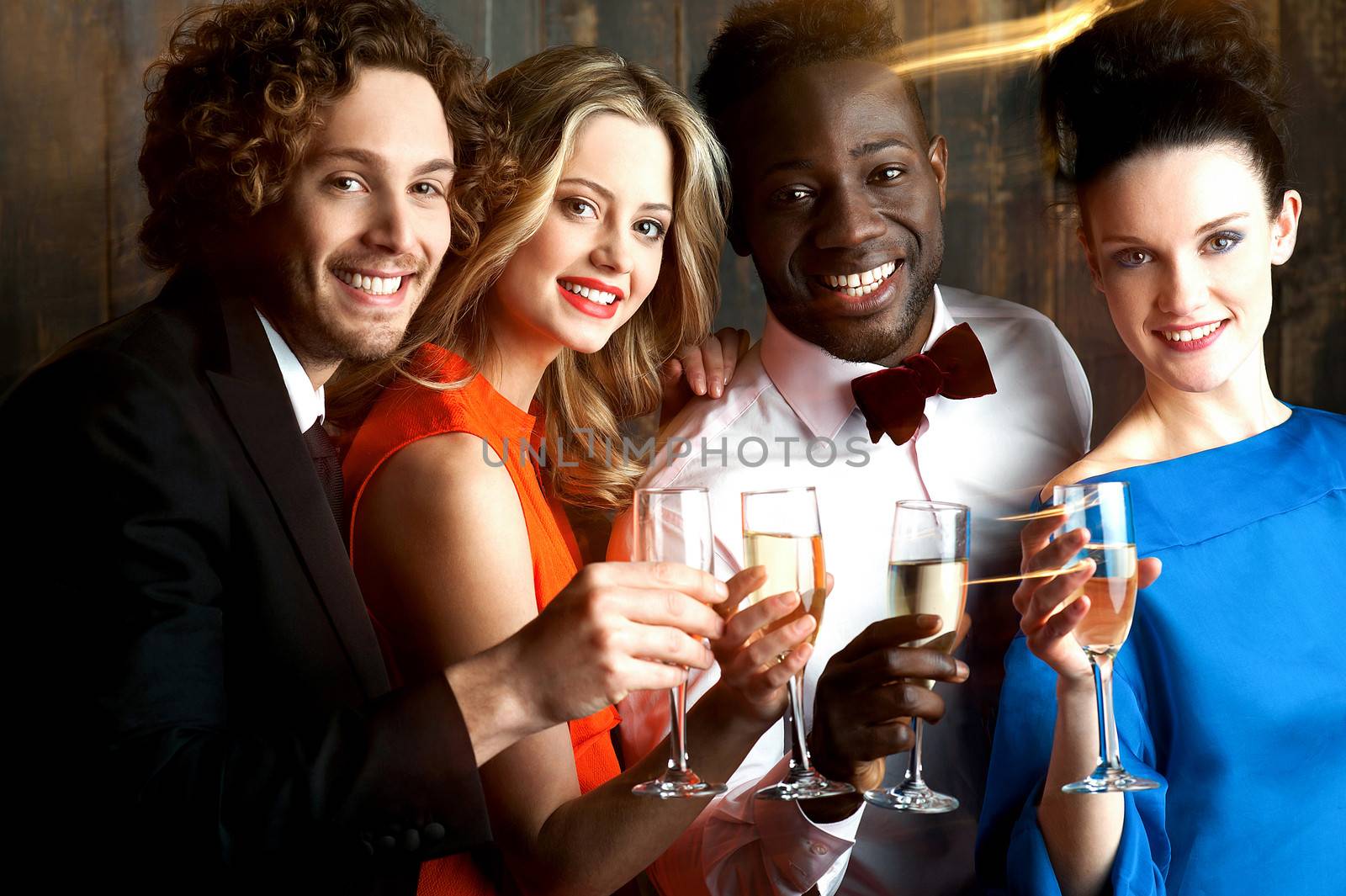 Group of friends at the bar, cheers to all... by stockyimages