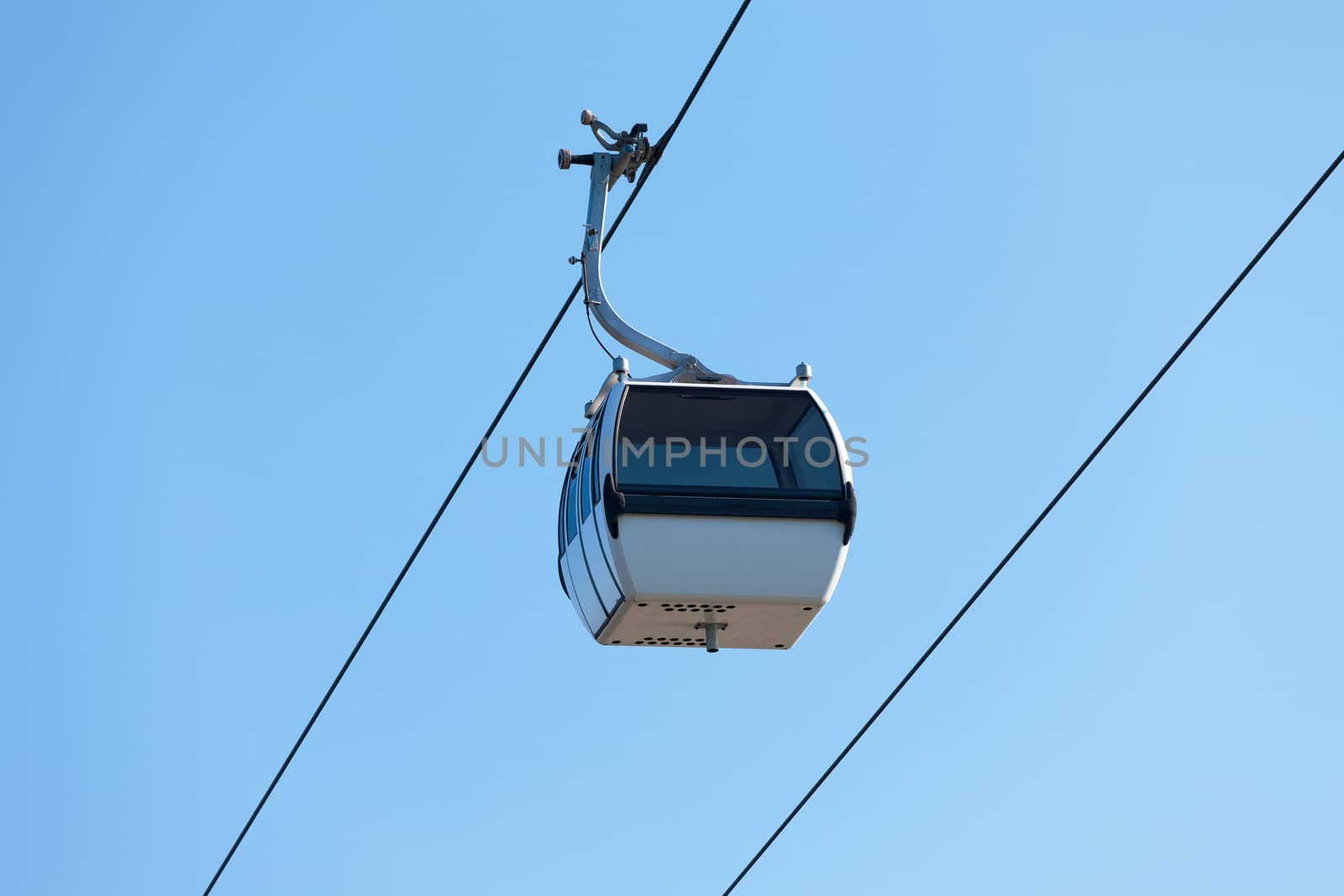 Cable car on blue sky background by Discovod