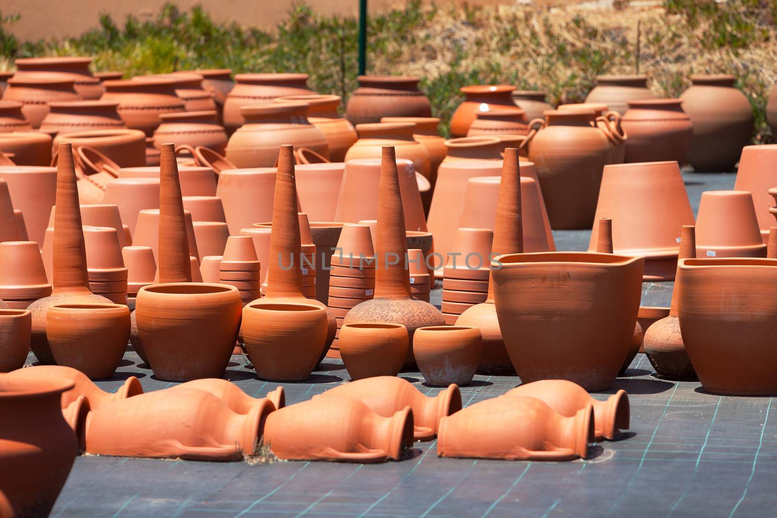 ceramic pots in market, sunny day
