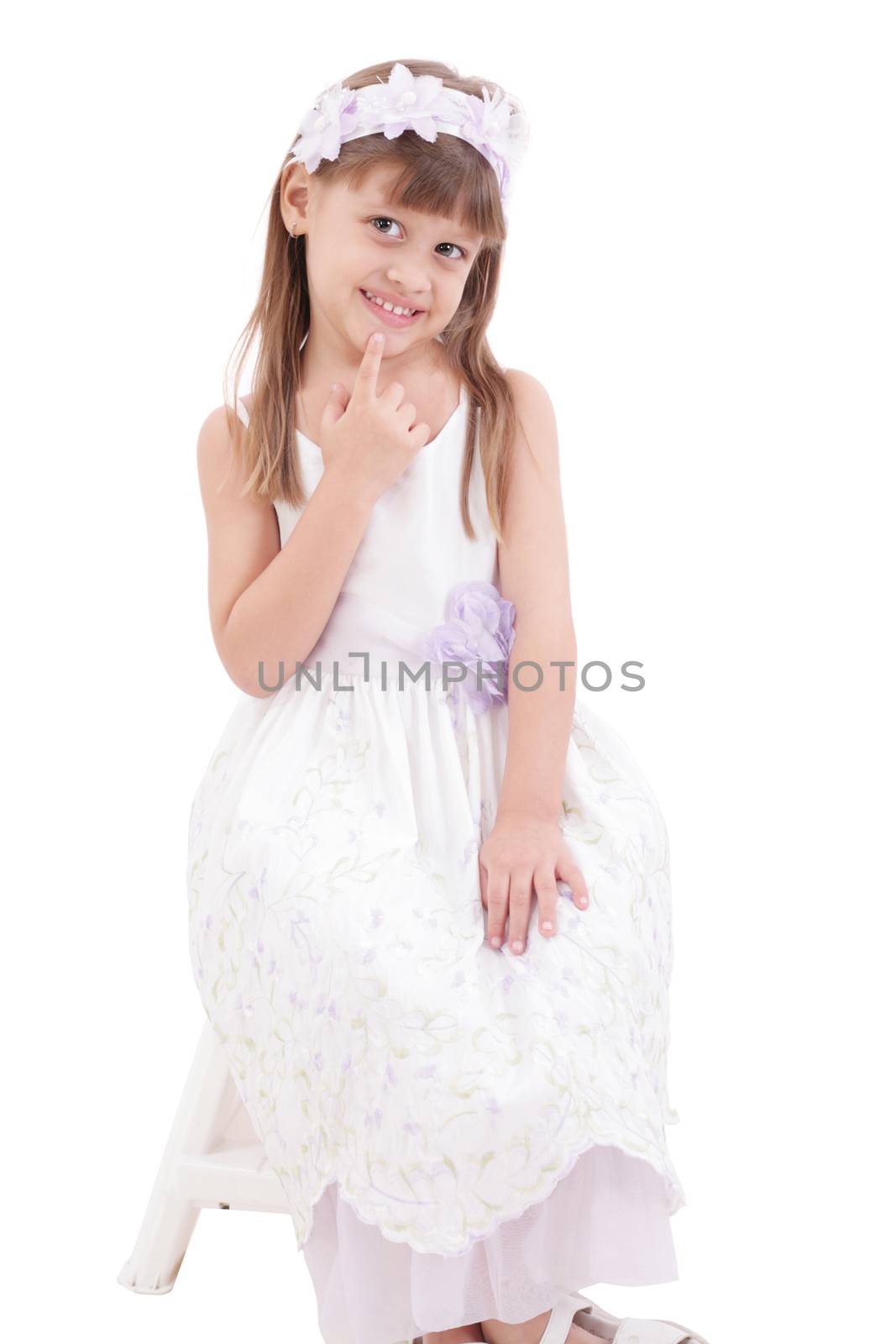 A portrait of a cheerful little girl on the white background