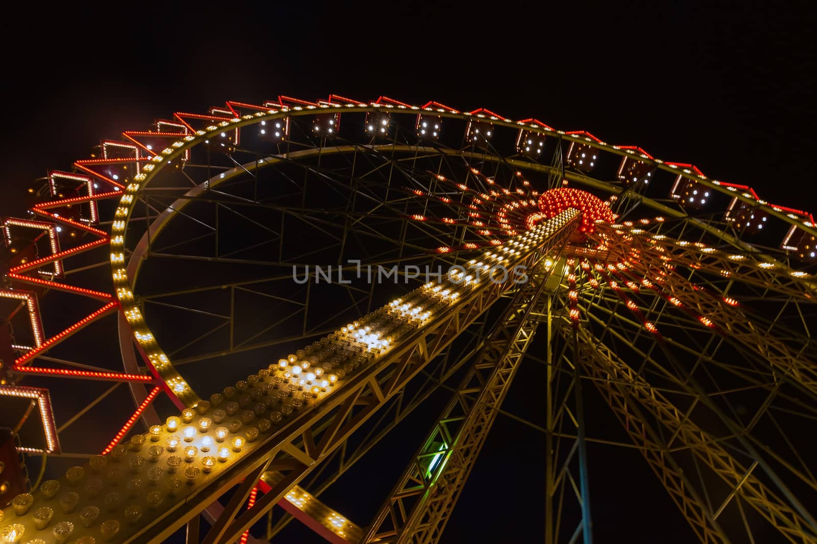 Ferris wheel illuminated in Odessa, Shevchenko Park. Ukraine.
