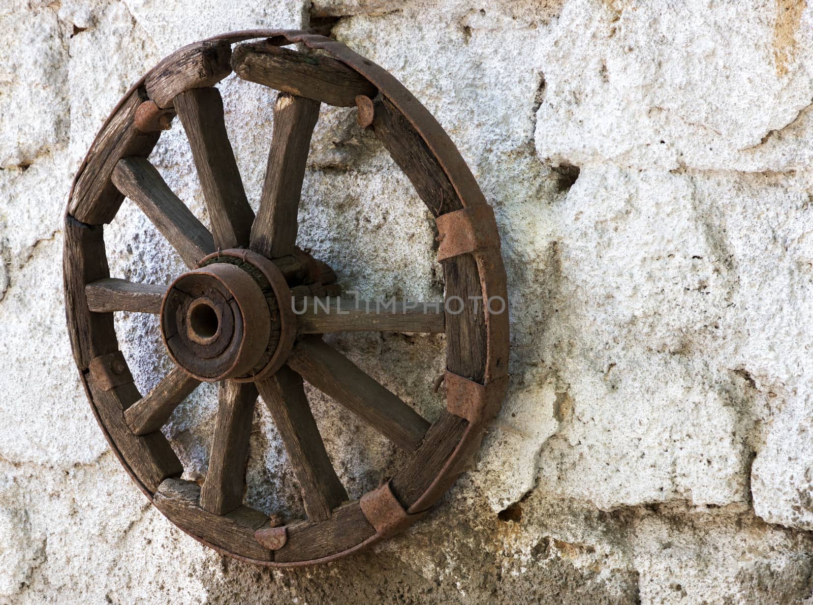 old wheel cart on white wall background