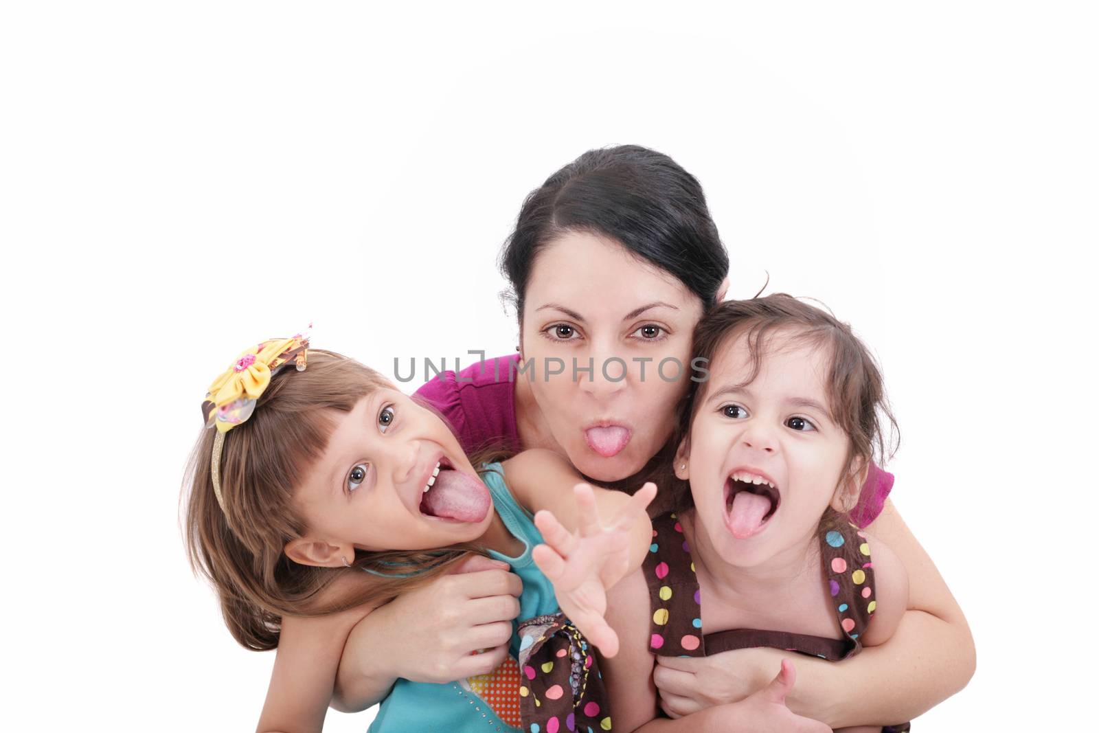 Mother and two daughter pulling funny faces at camera by dacasdo