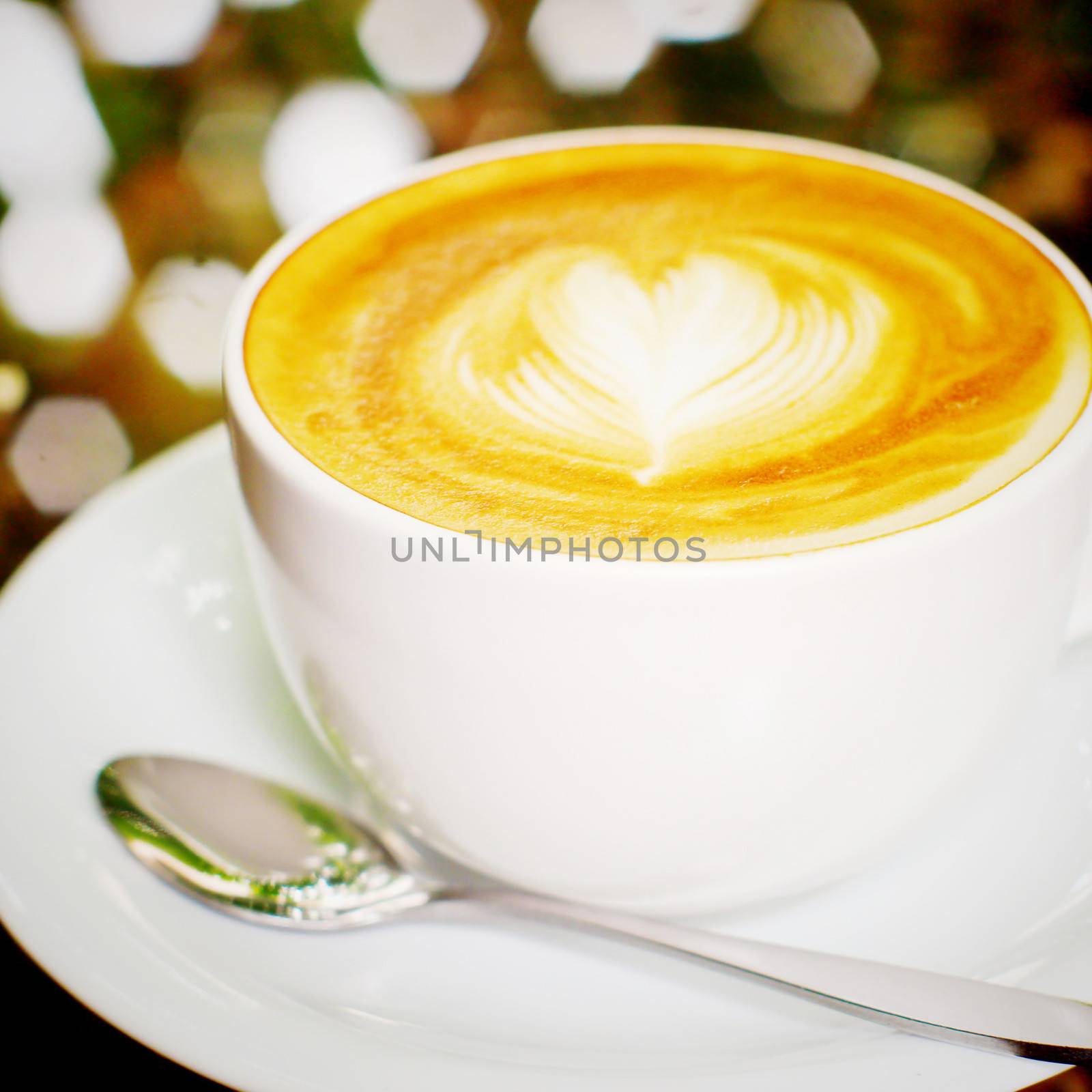 Cappuccino or latte coffee with heart shape, retro filter effect by nuchylee