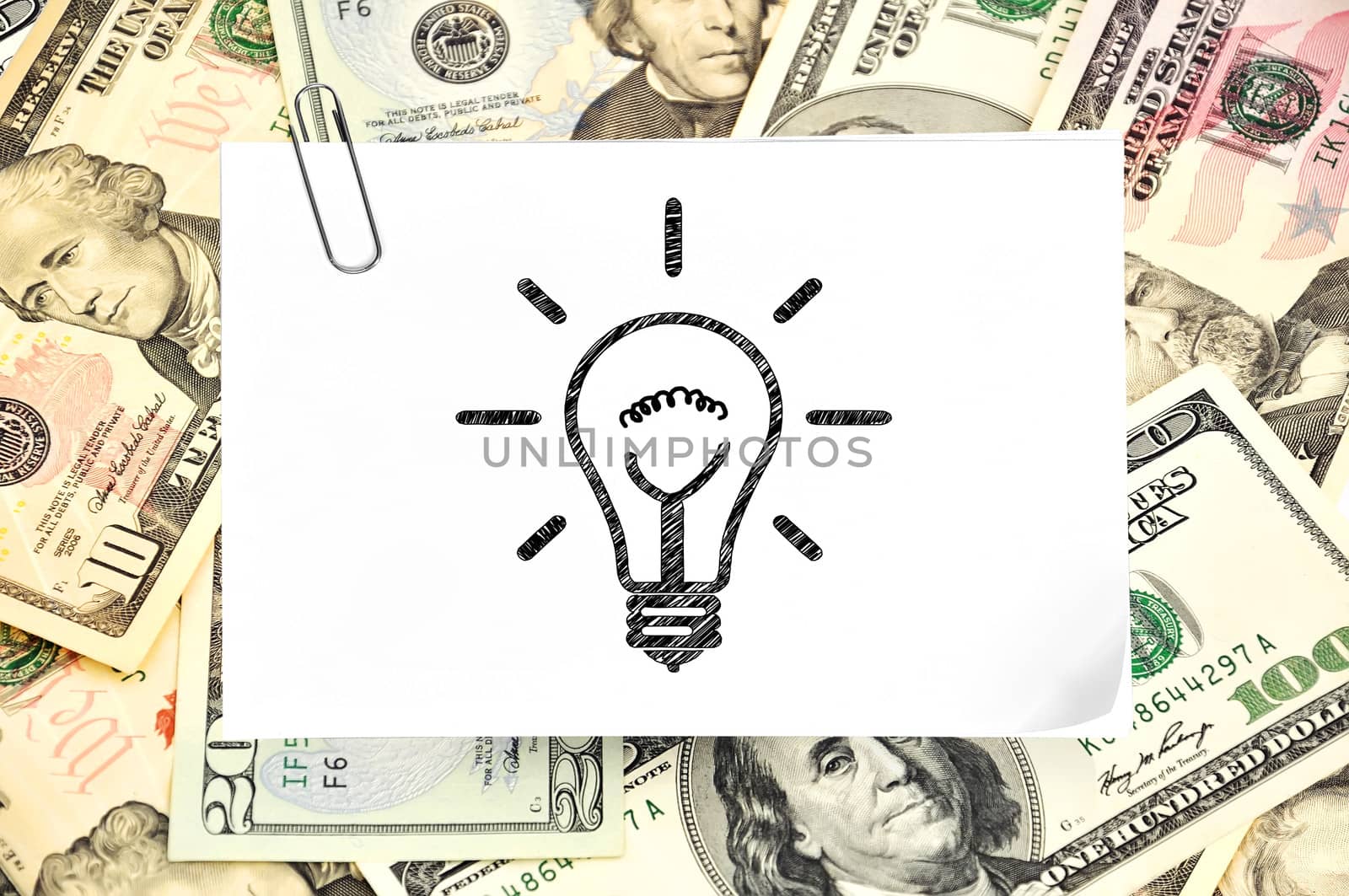 paper with drawing lamp on money background