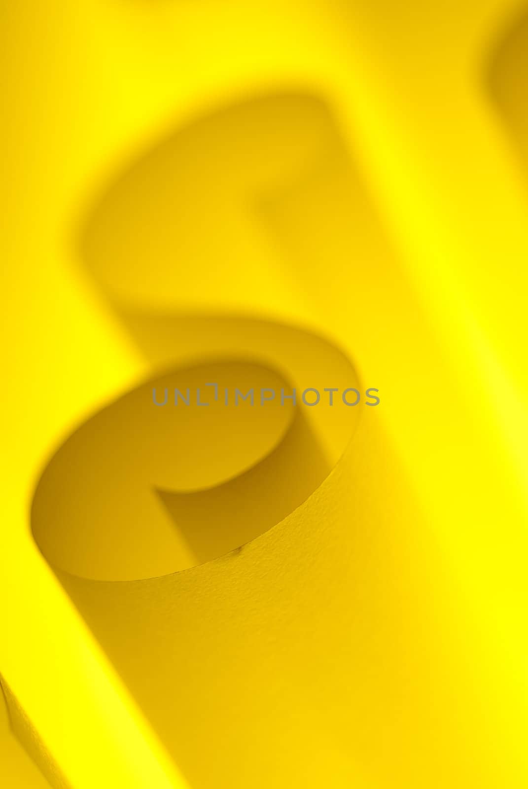 Blank yellow design paper curled up with soft light