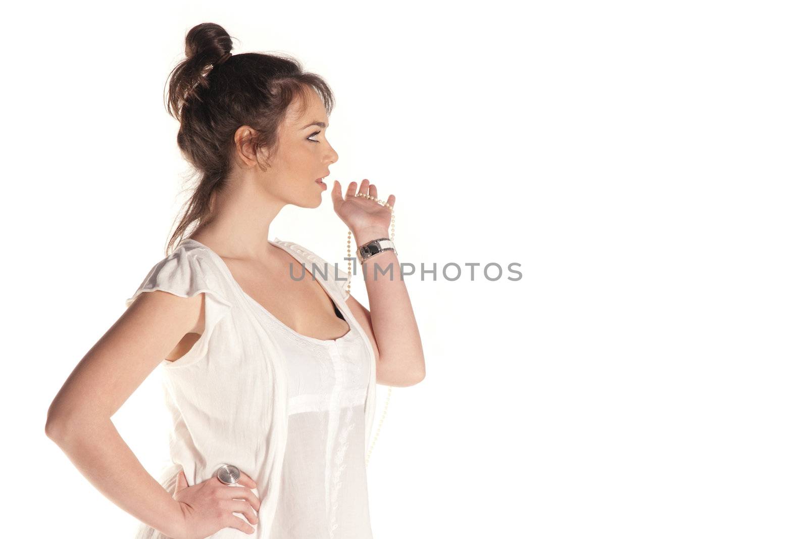 Young woman sideshot looking at something isolated on white