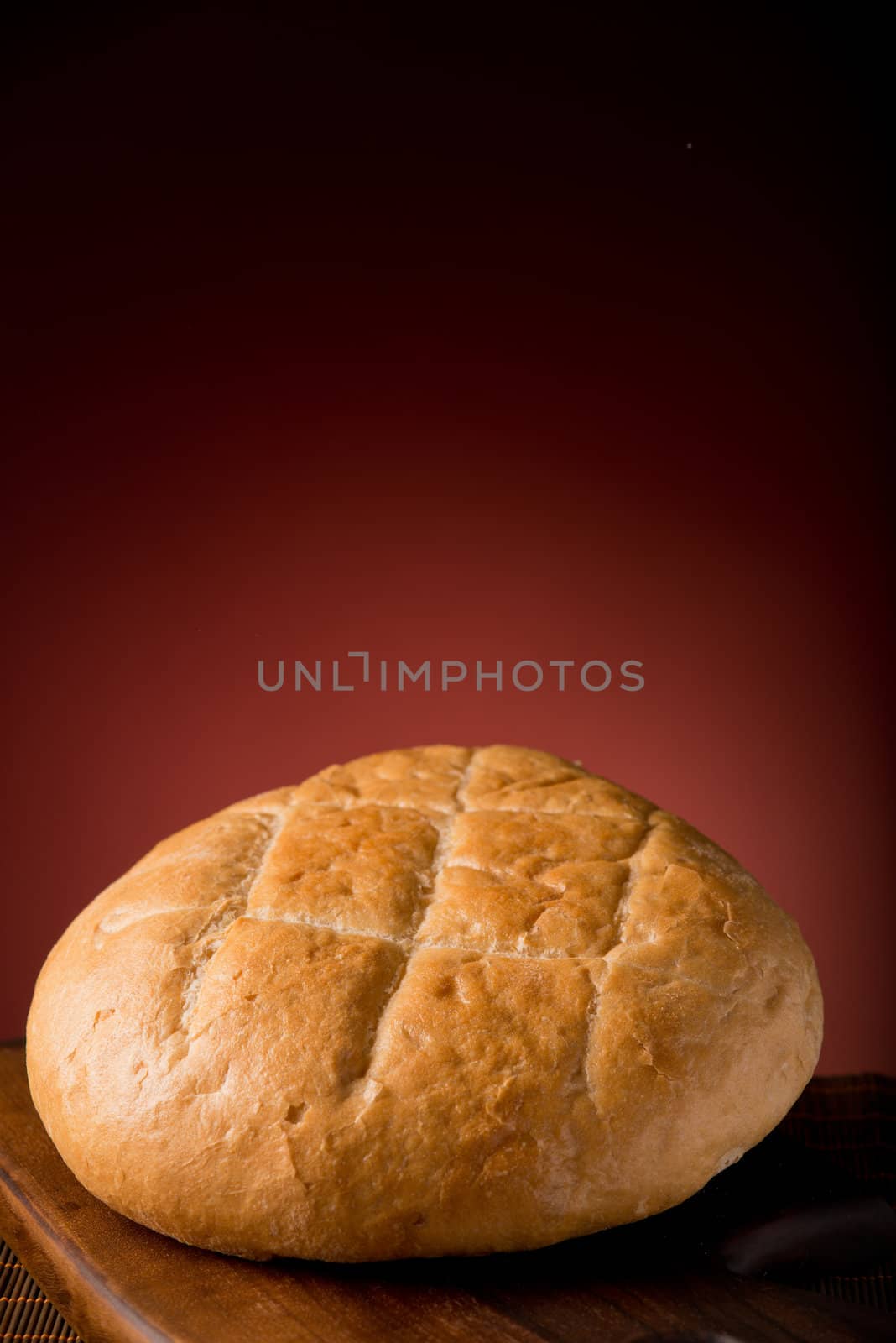 Baked bread on a cutting board in studio