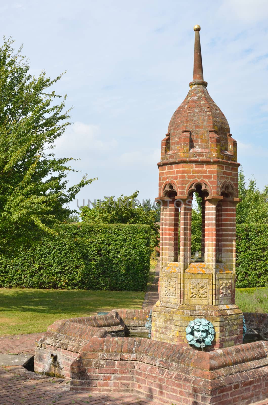 Ornate water feature in classical garden