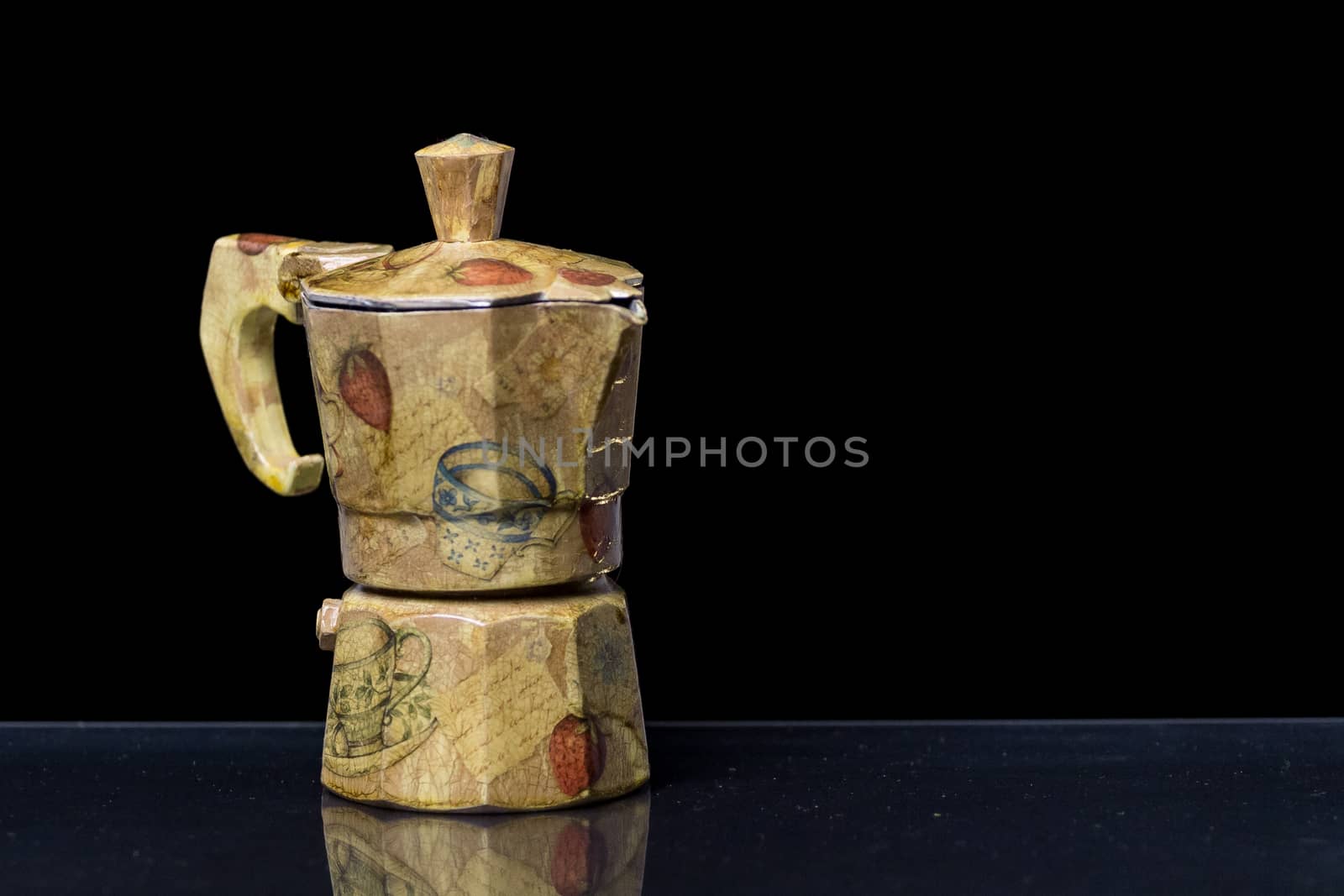 A decorated Moka italian coffee machine with fruit and vintage handcrafted decoupage work on a reflective black surface with black background







A decorated Moka italian coffee machine with fruit and vintage handcrafted decoupage work