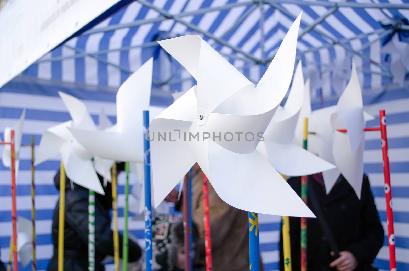 paper windmills sell in outdoor street donation charity event for poor lonely kids.