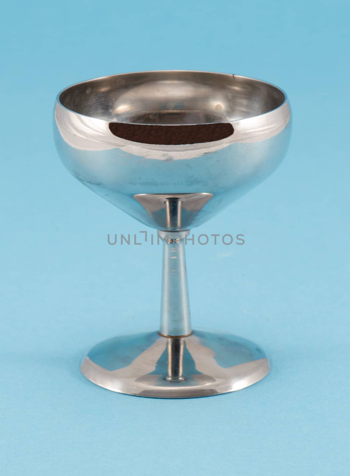 retro grunge wine glass goblet on blue background by sauletas