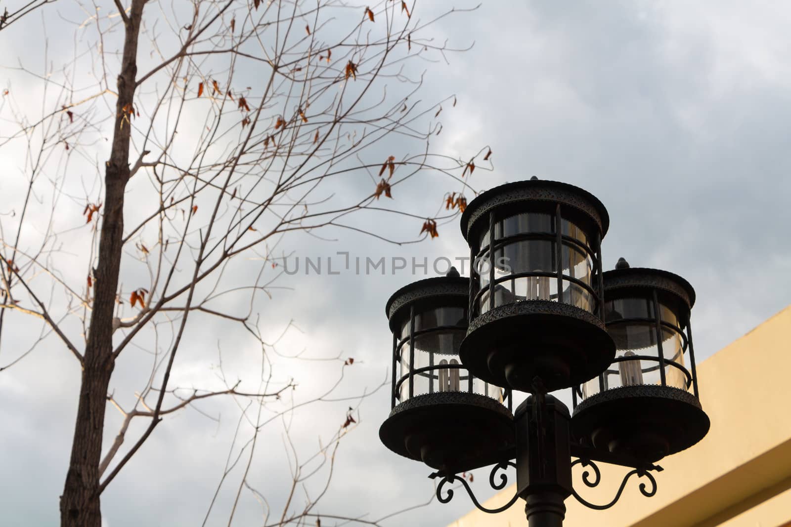 Lamp post and cloudy sky.