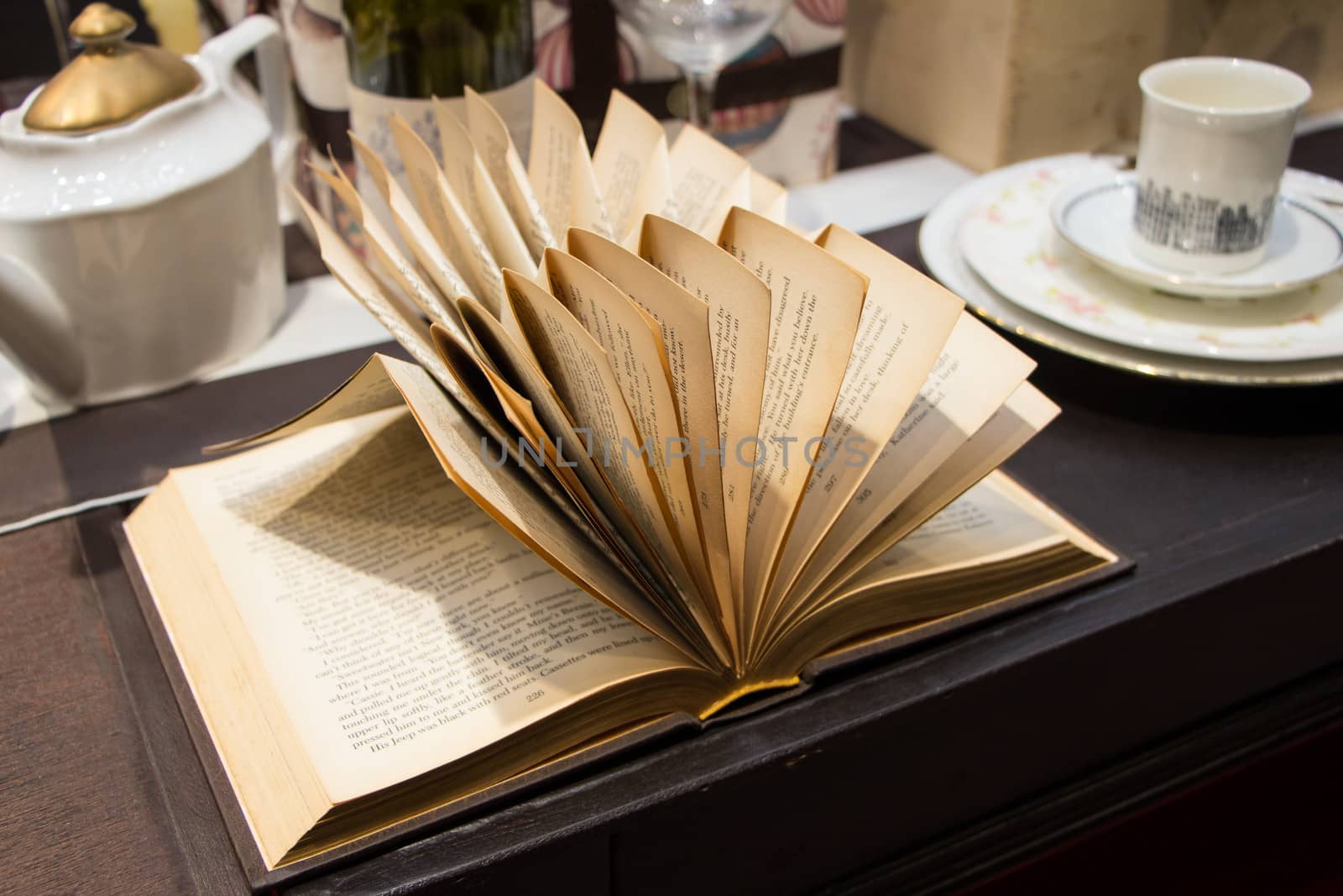 Open book on wooden table