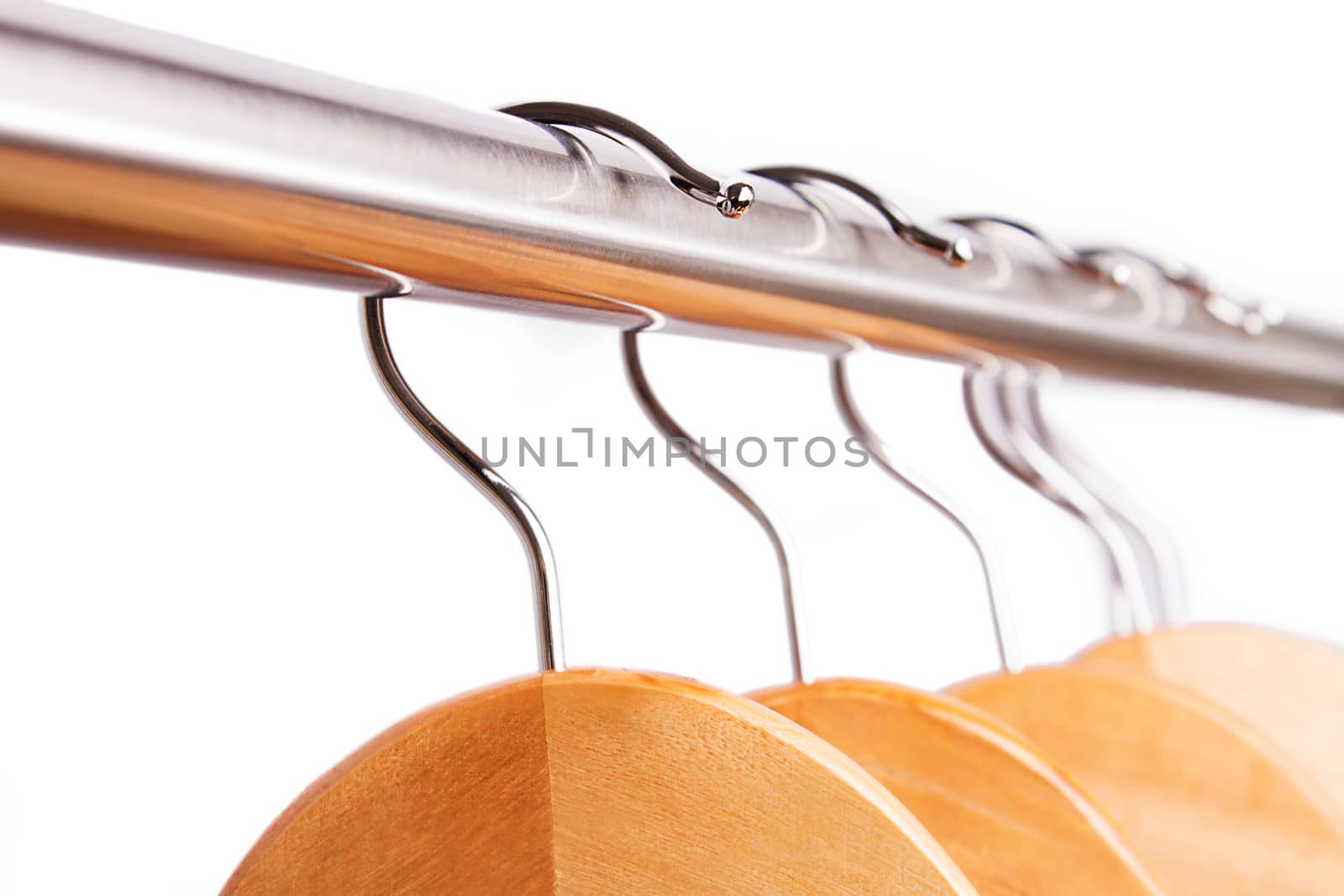 Empty raw of hangers isolated on white by Angel_a