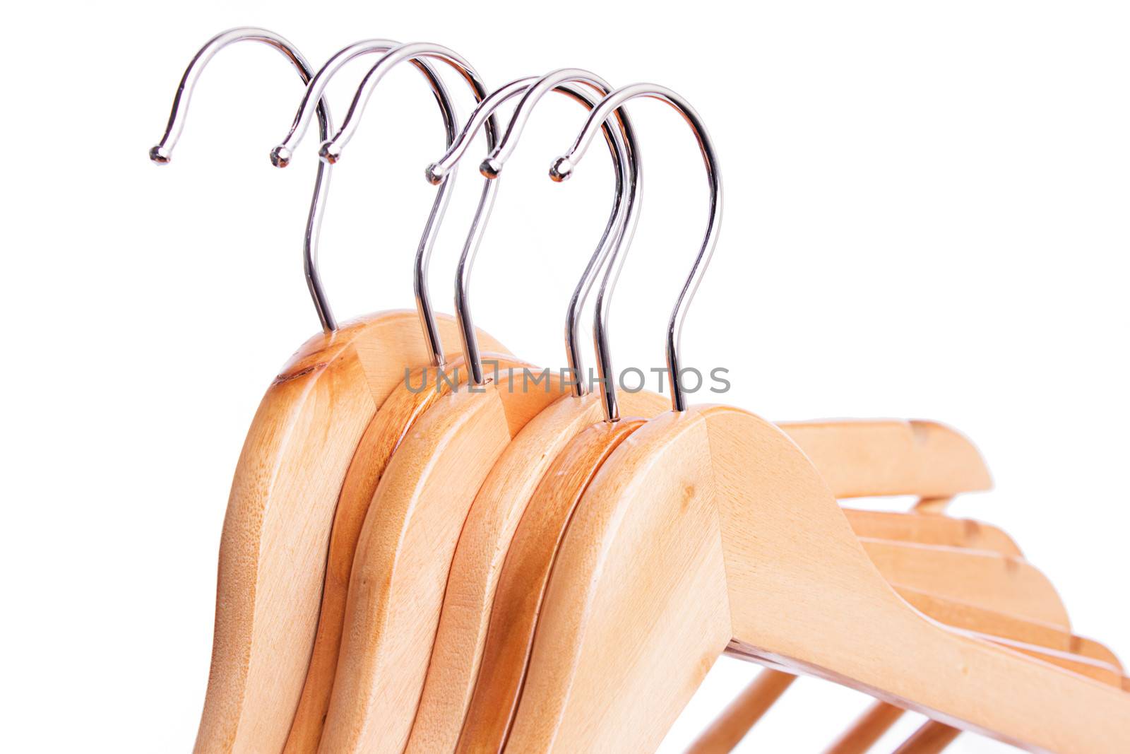 Some wooden hangers in raw isolated on white, sales concept