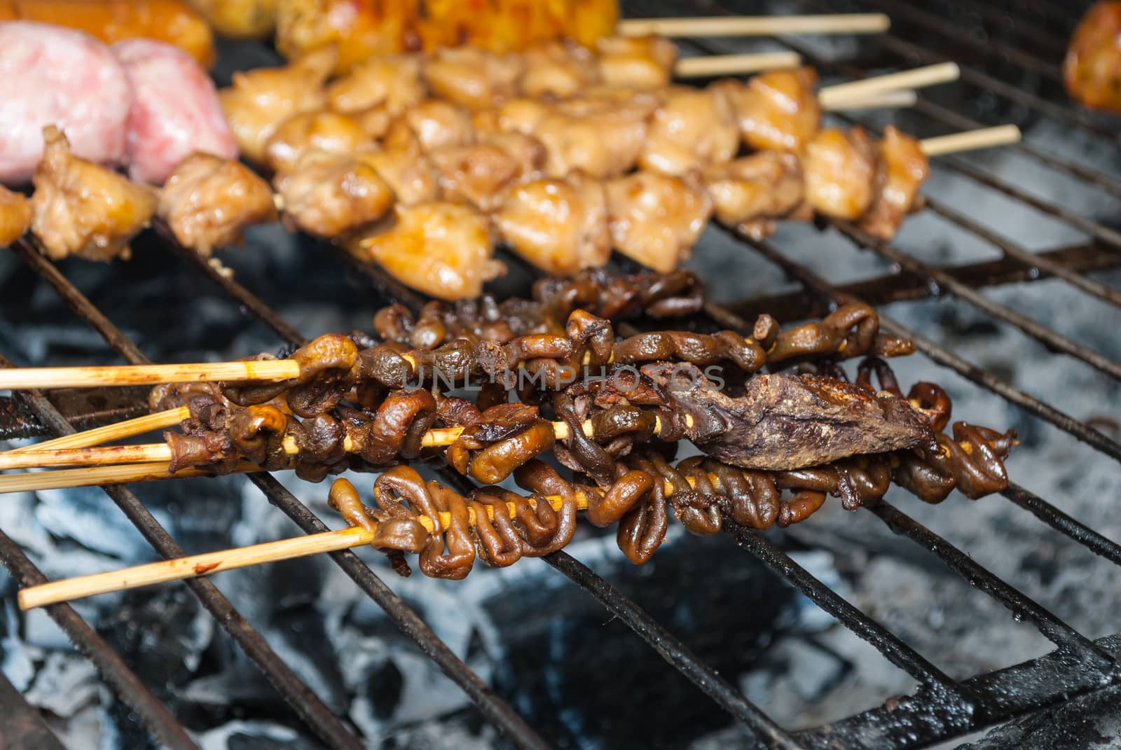 Grilled Chicken Entrails on Barbecue Grid.