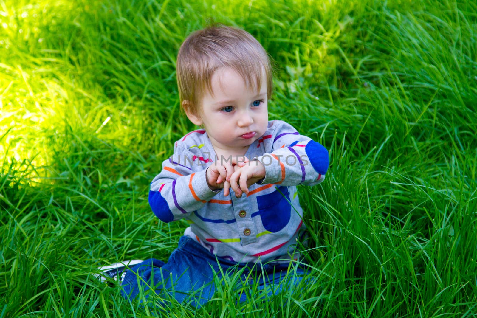 Boy Playing in Grass by joshuaraineyphotography