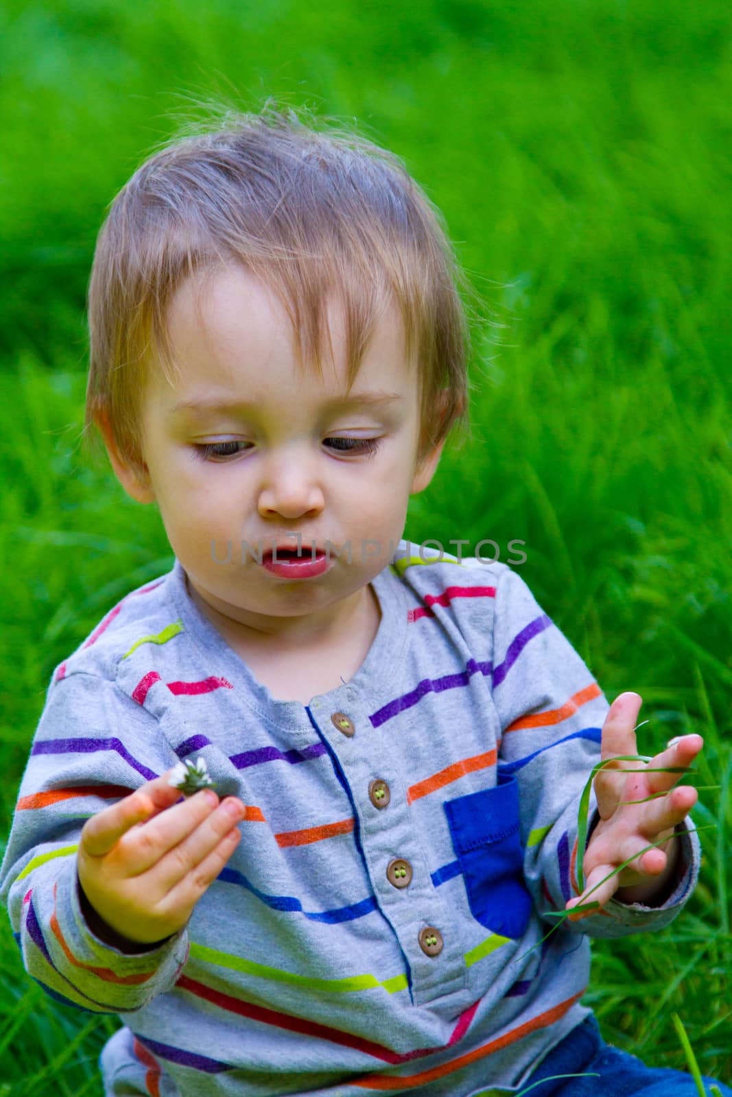 Boy Playing in Grass by joshuaraineyphotography