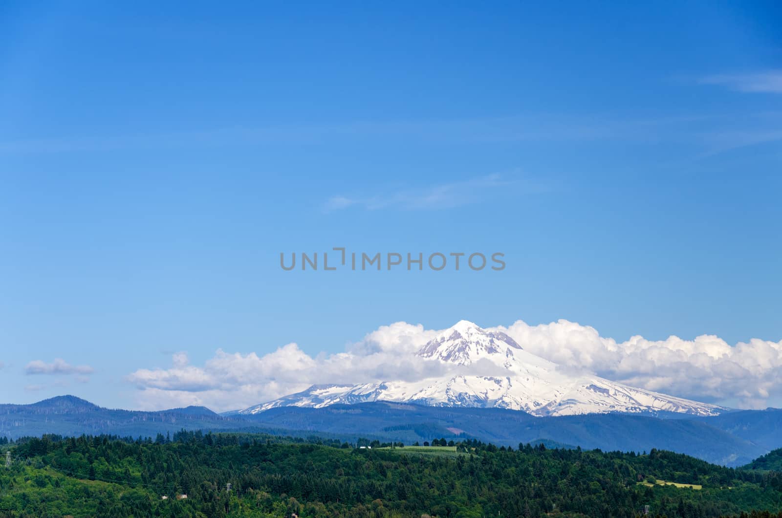 Mount Hood partially obscured by clouds