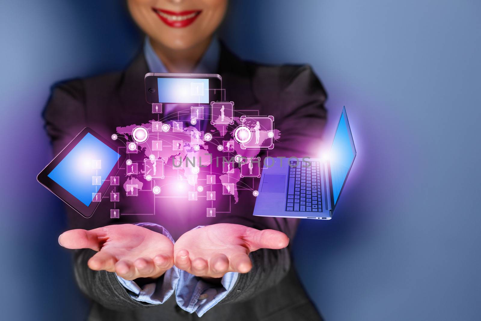 Close up image of businesswoman with 3d images of devices in her hands