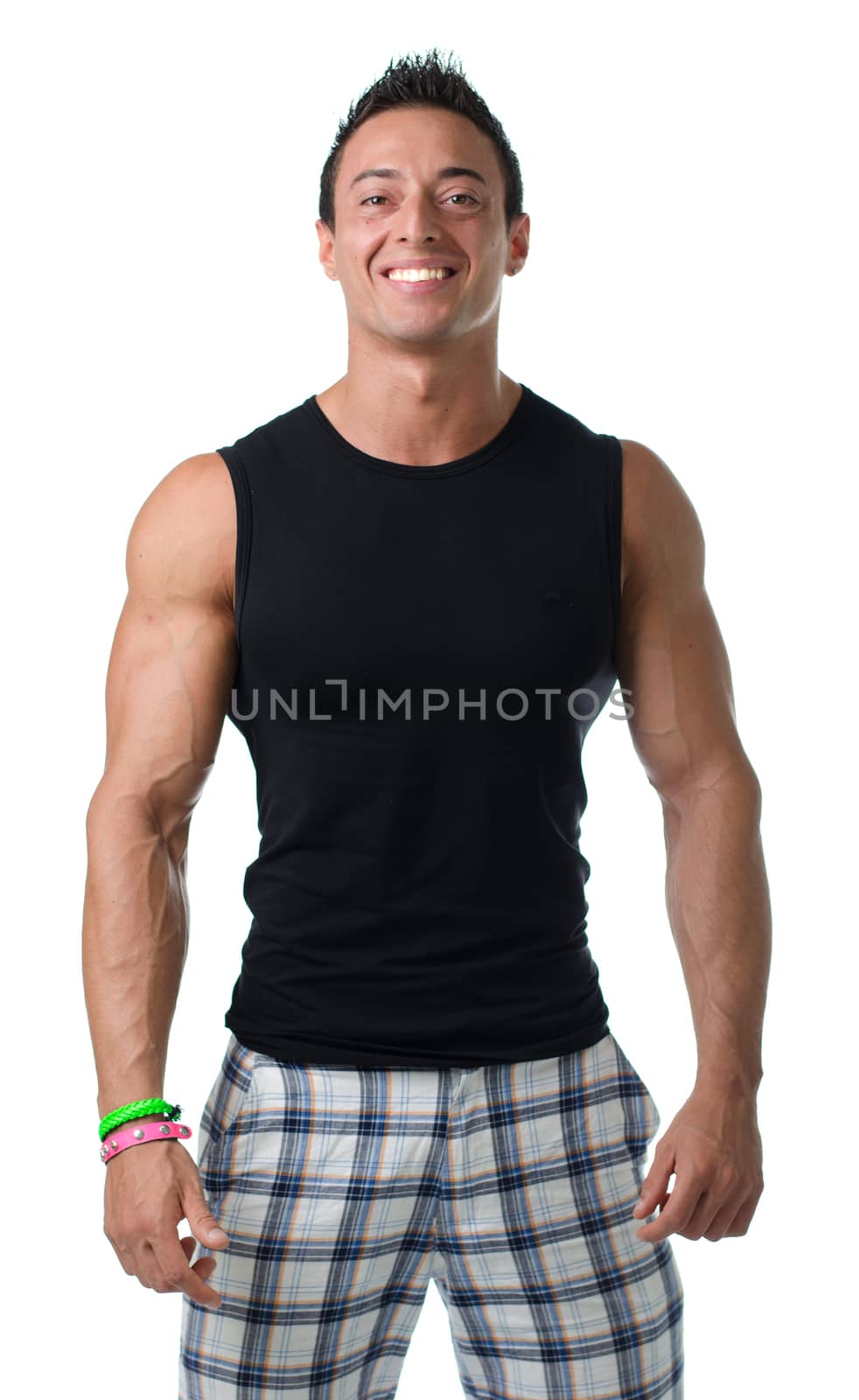 Handsome, muscular young man with black tanktop  smiling isolated on white