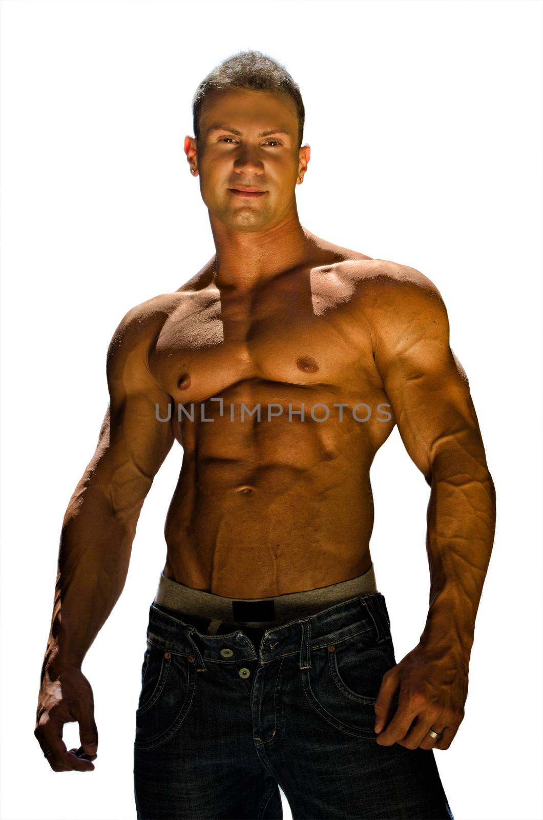 Handsome, muscular shirtless bodybuilder with jeans looking in camera isolated on white