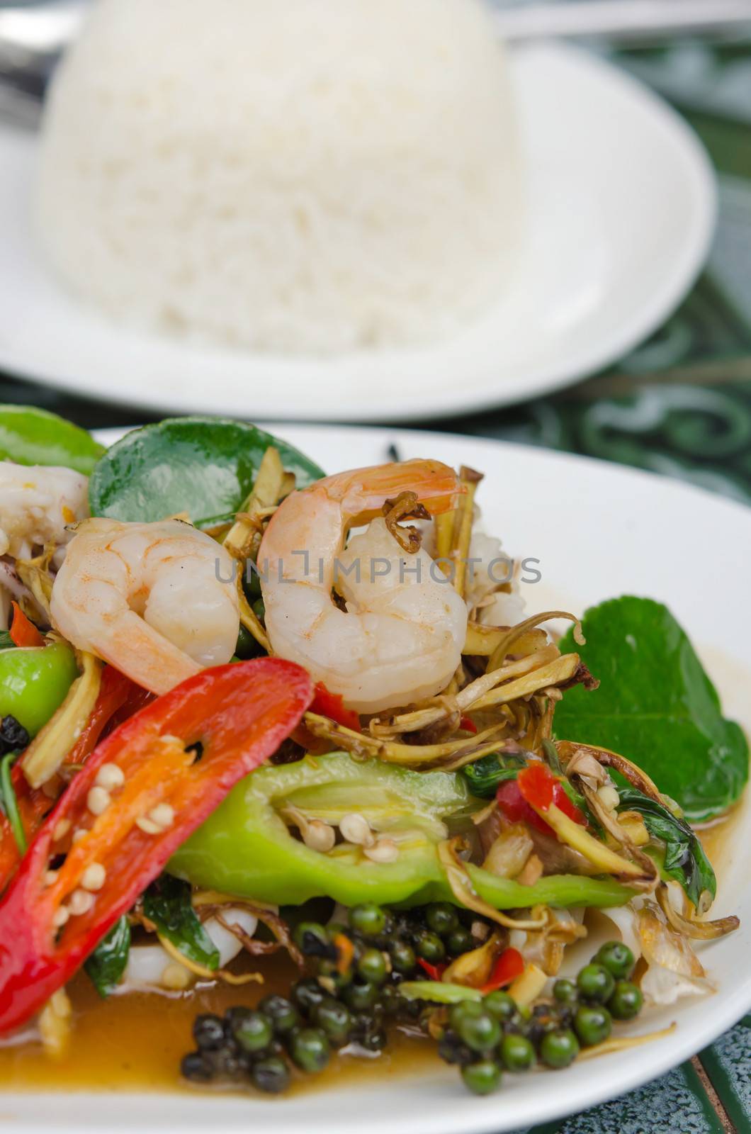 Fried herbal vegetables with mix seafood  served with rice