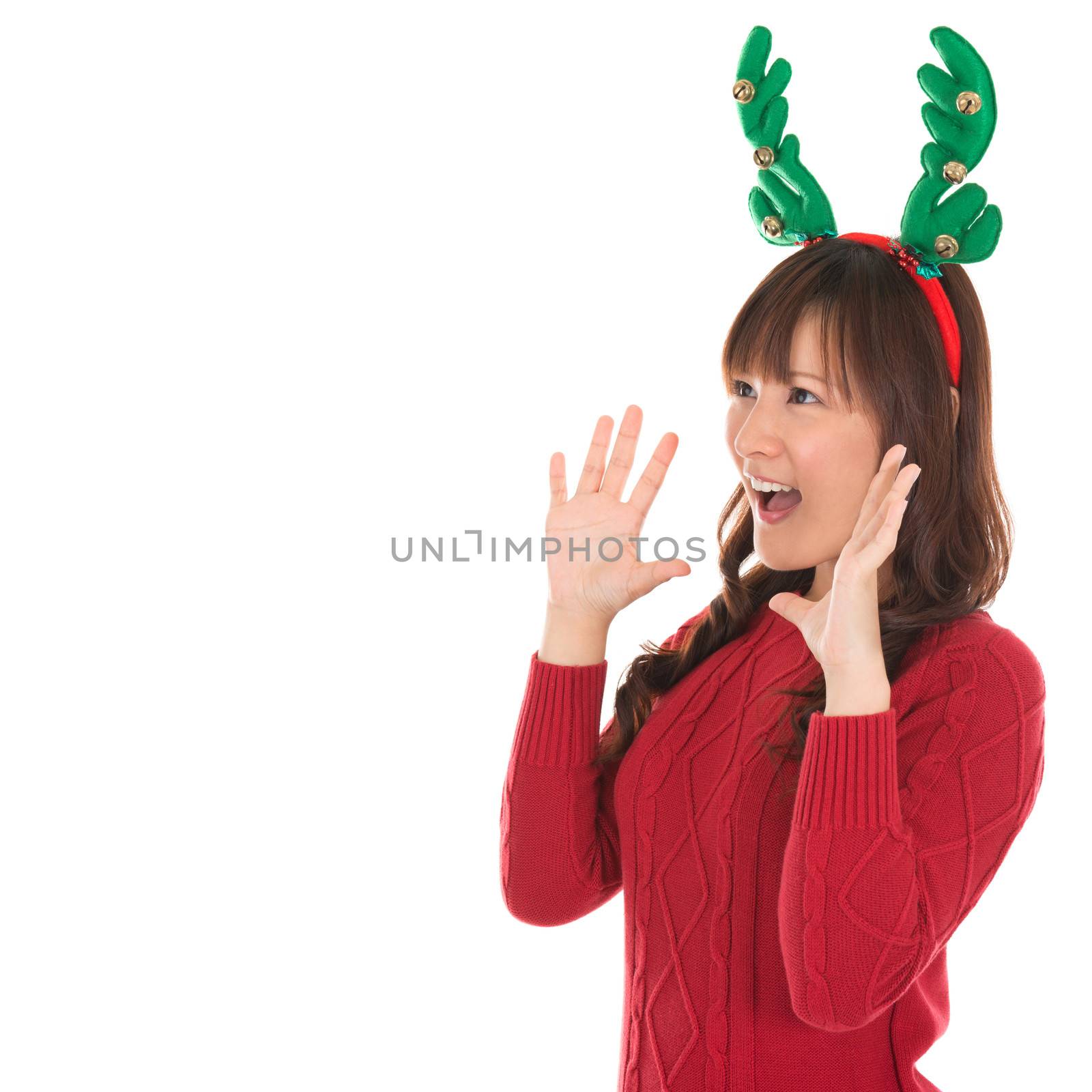Happy Asian Santa woman shouting isolated over white background. Asian female model.