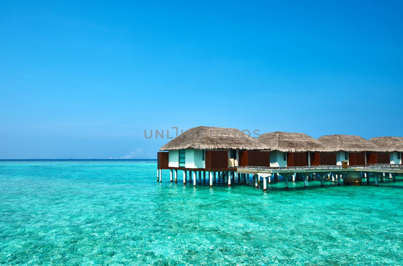 Beautiful beach with water bungalows at Maldives