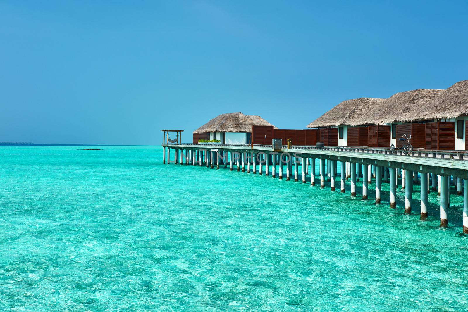 Beautiful beach with water bungalows at Maldives
