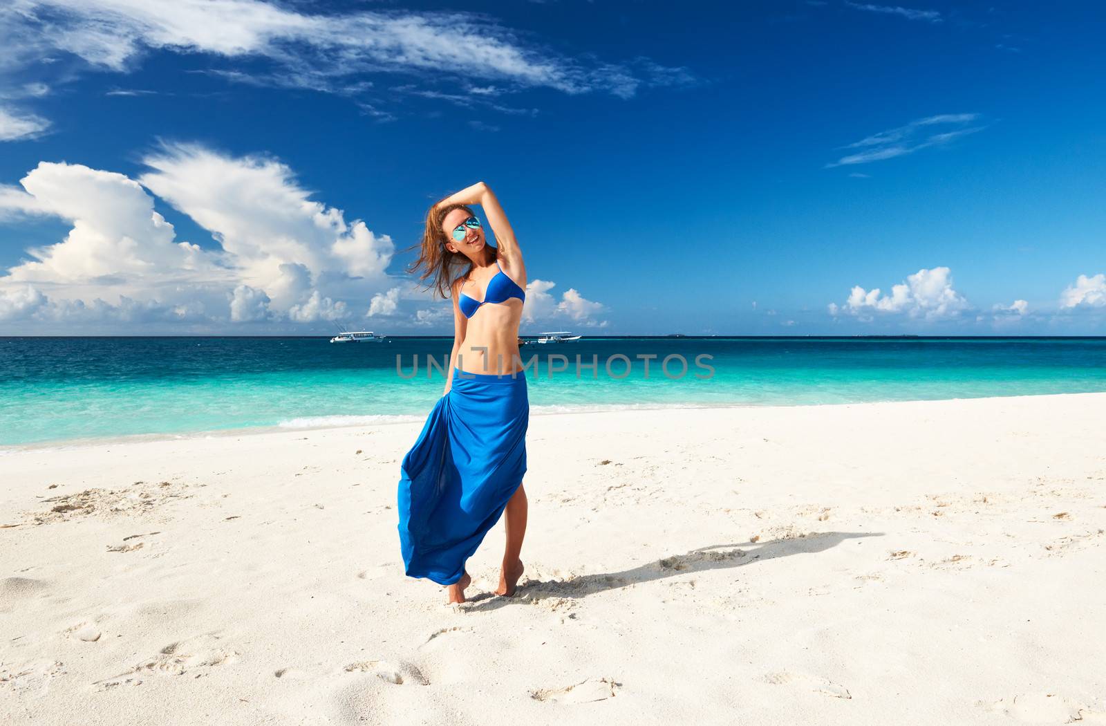 Woman in skirt at tropical beach