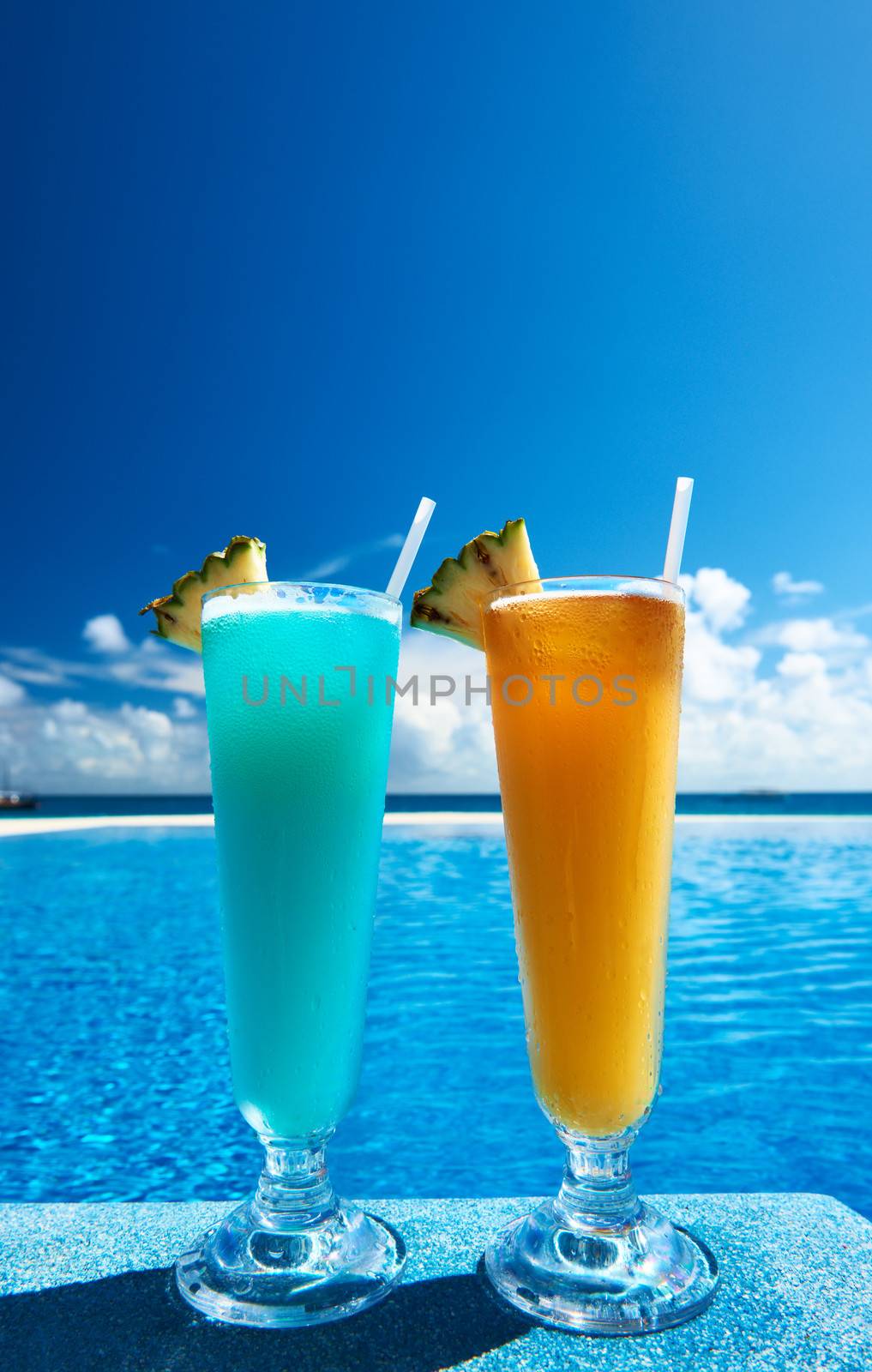 Cocktails near swimming pool by haveseen