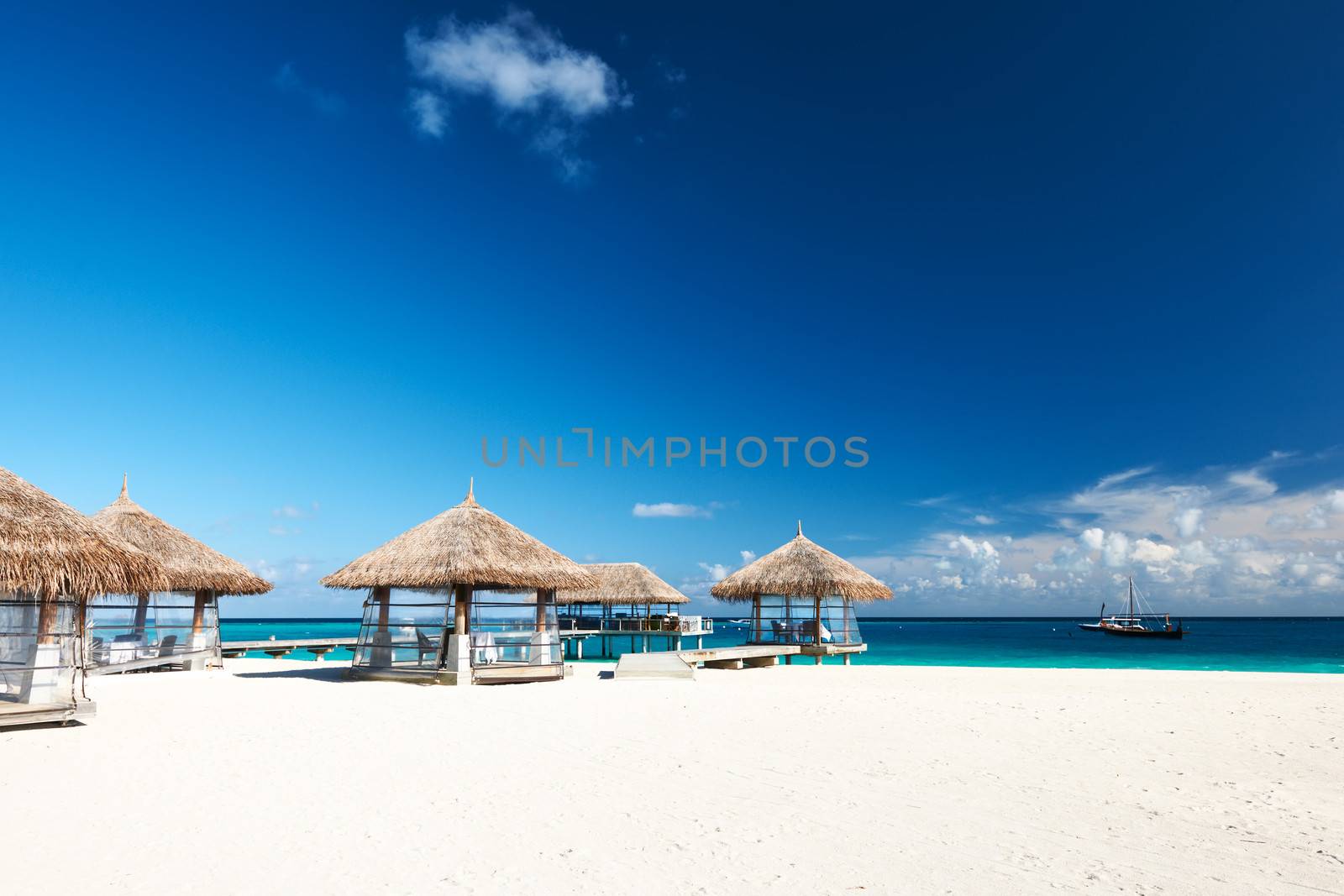 Beautiful beach with bungalow jetty at Maldives