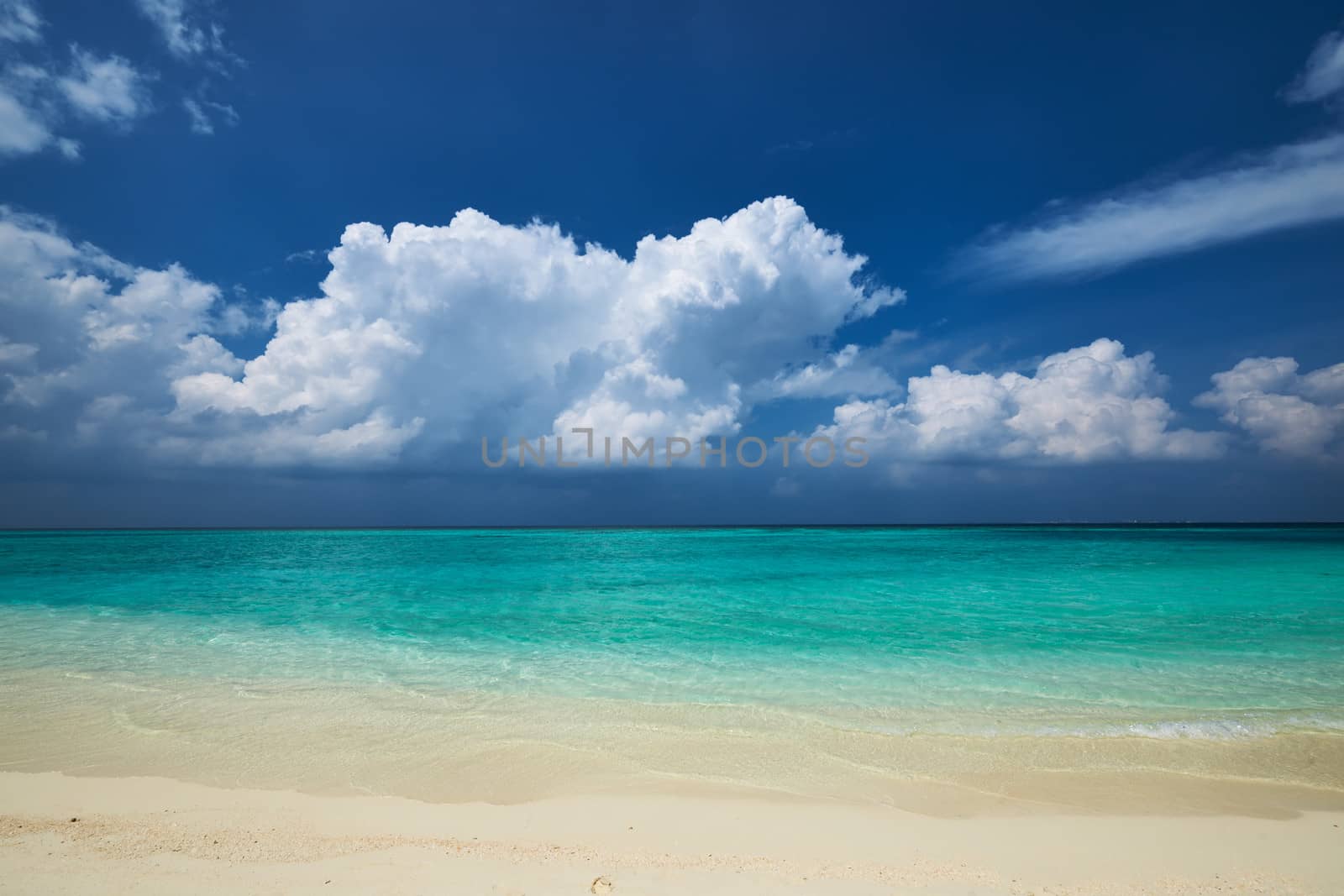 Crystal clear turquoise water at tropical maldivian beach