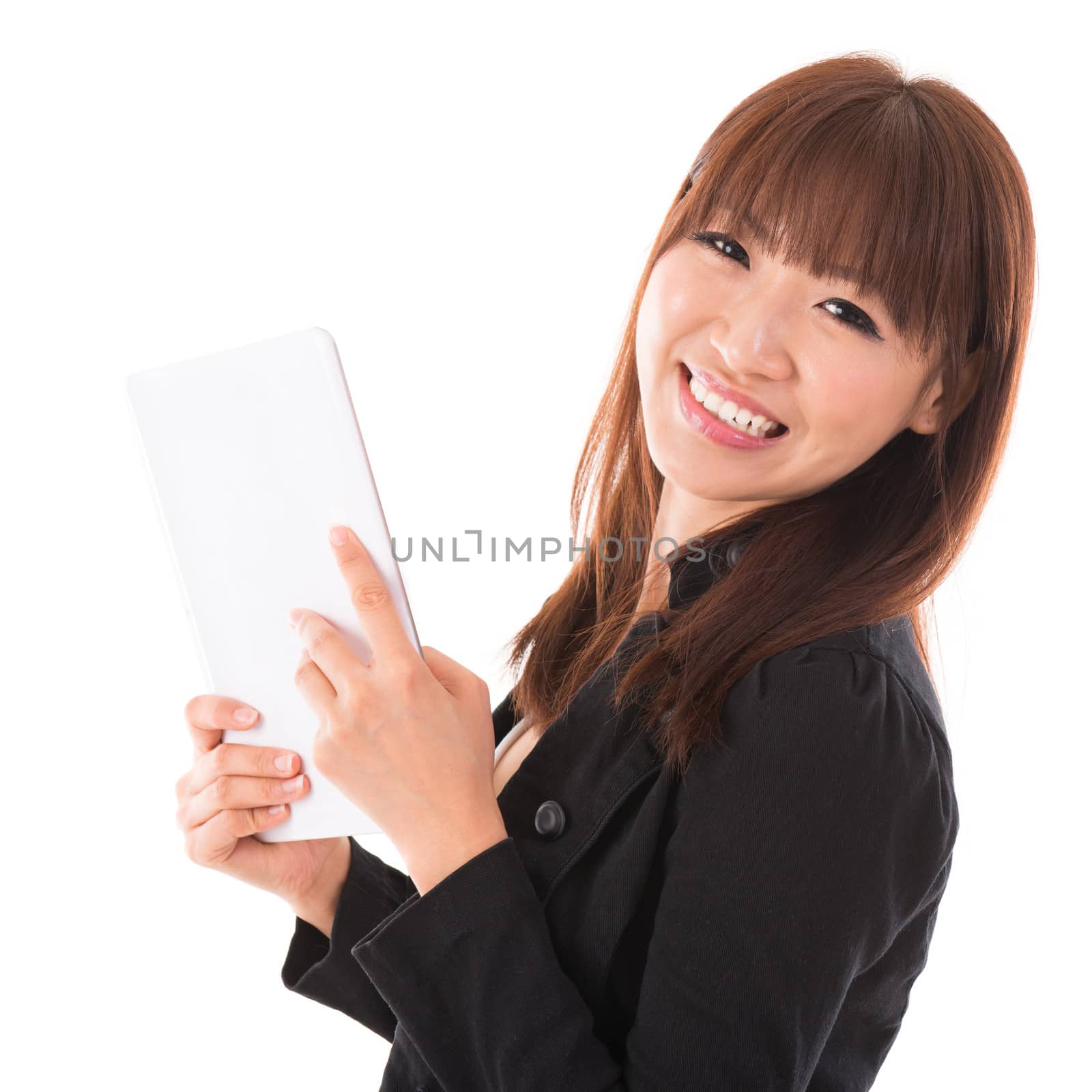 Portrait of happy Asian woman using a tablet pc isolated on white background. Asian female model.