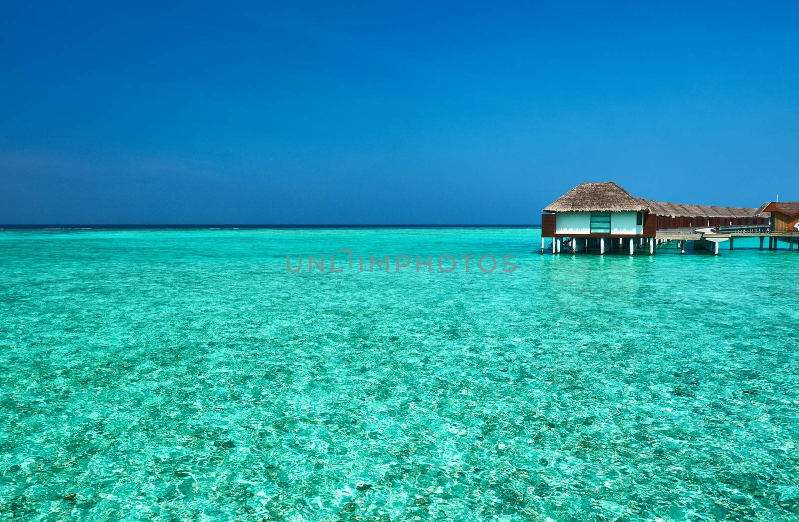 Beautiful beach with water bungalows at Maldives