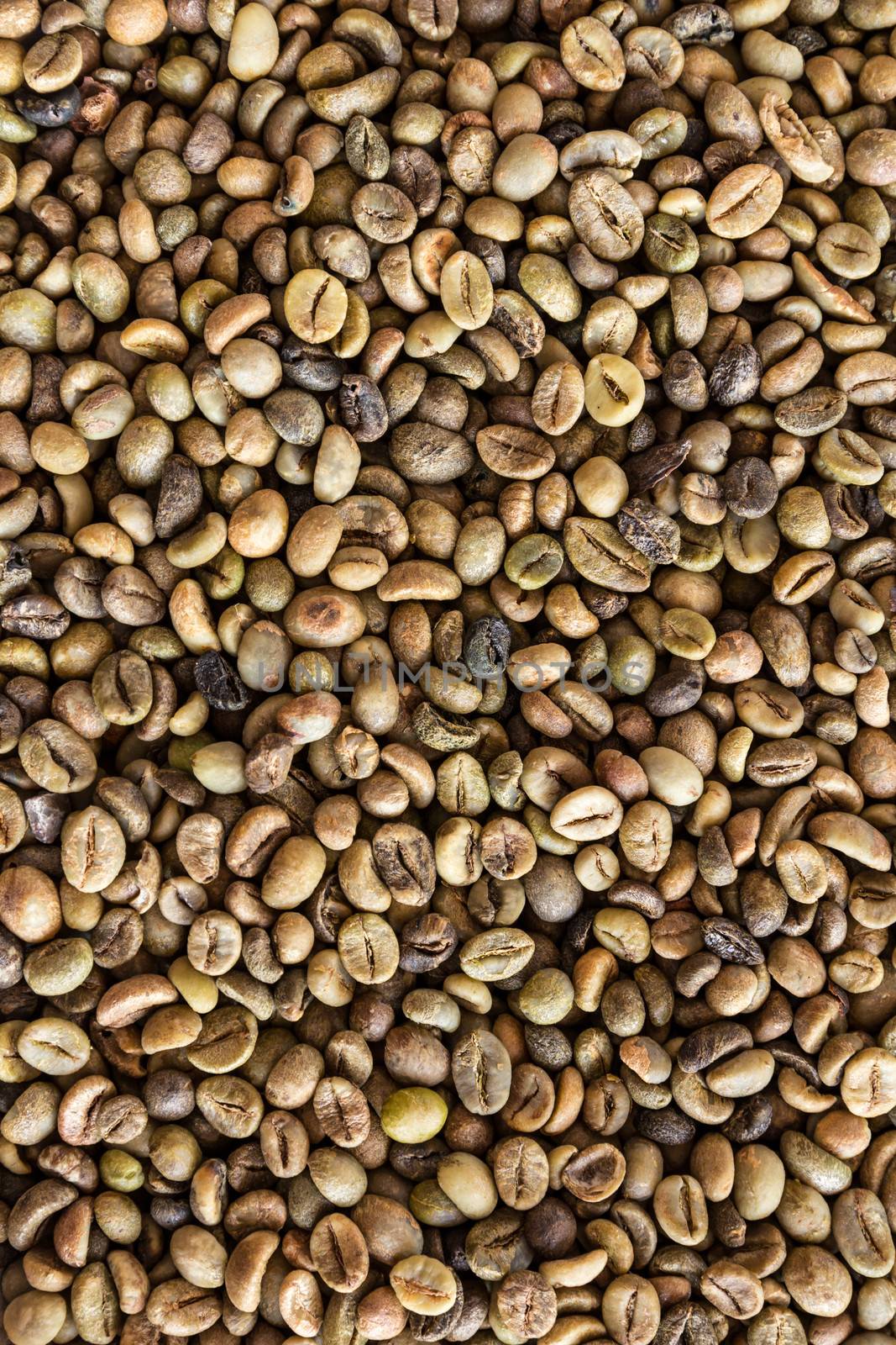 Coffee beans background at an angle with selective focus