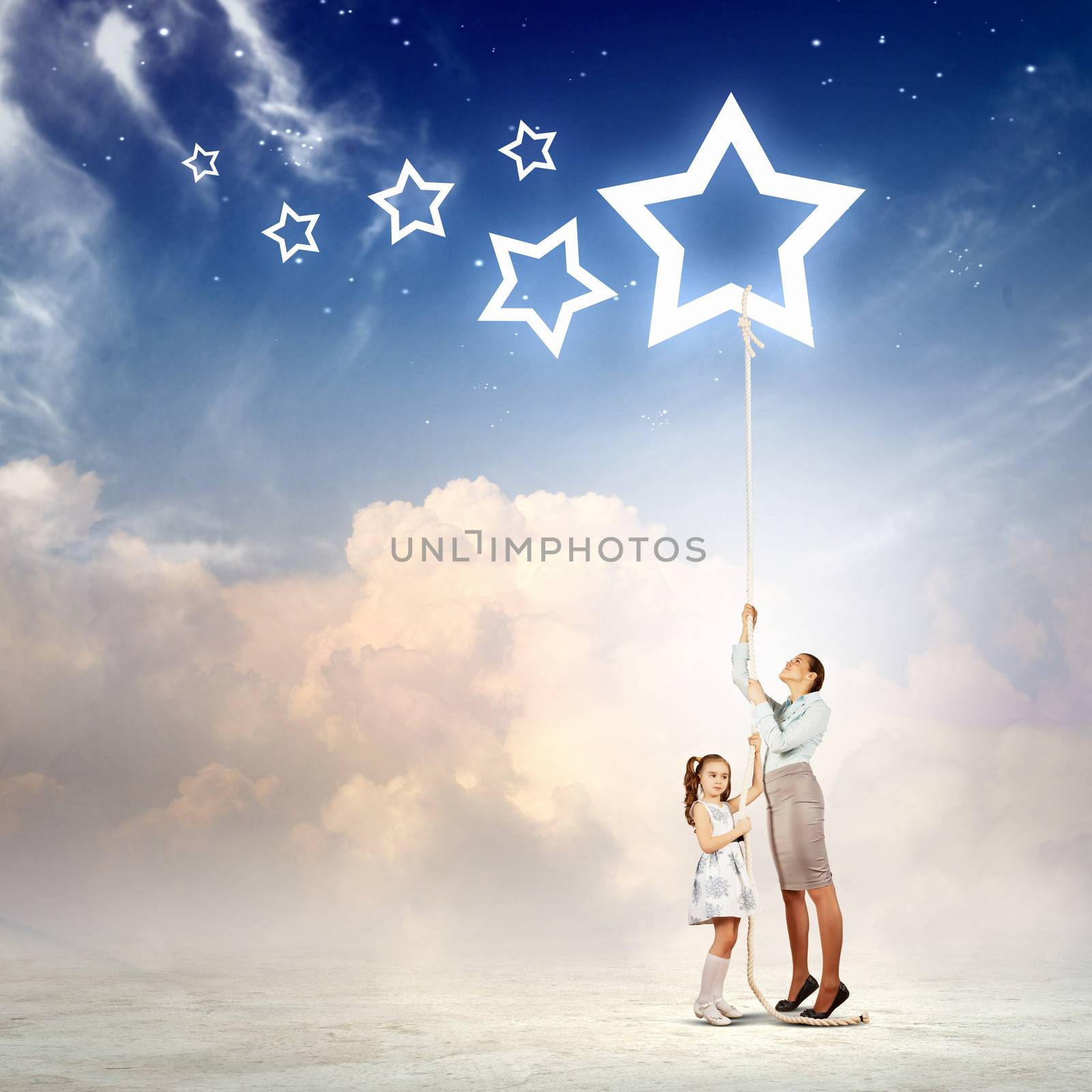 Image of young happy family pulling rope with a star symbol