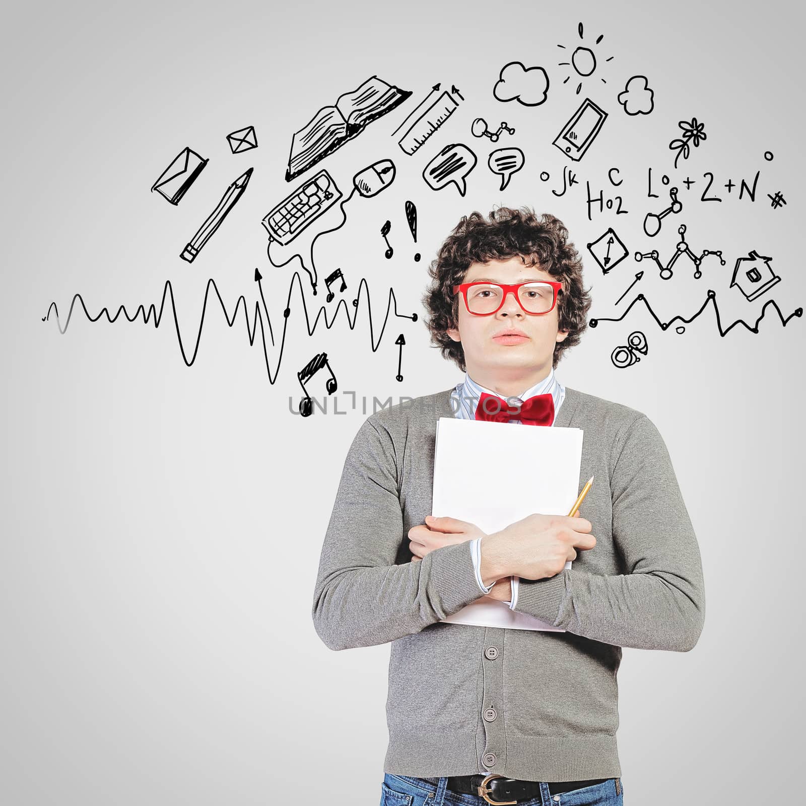 Young man in glasses standing and holding papers