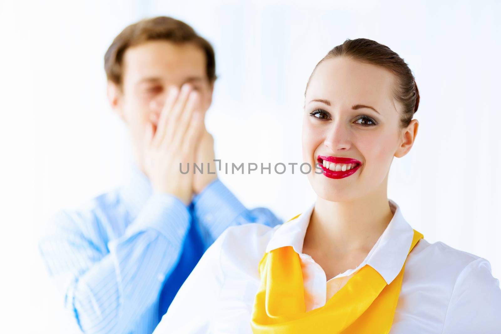 Image of businessman and businesswoman smiling joyfully