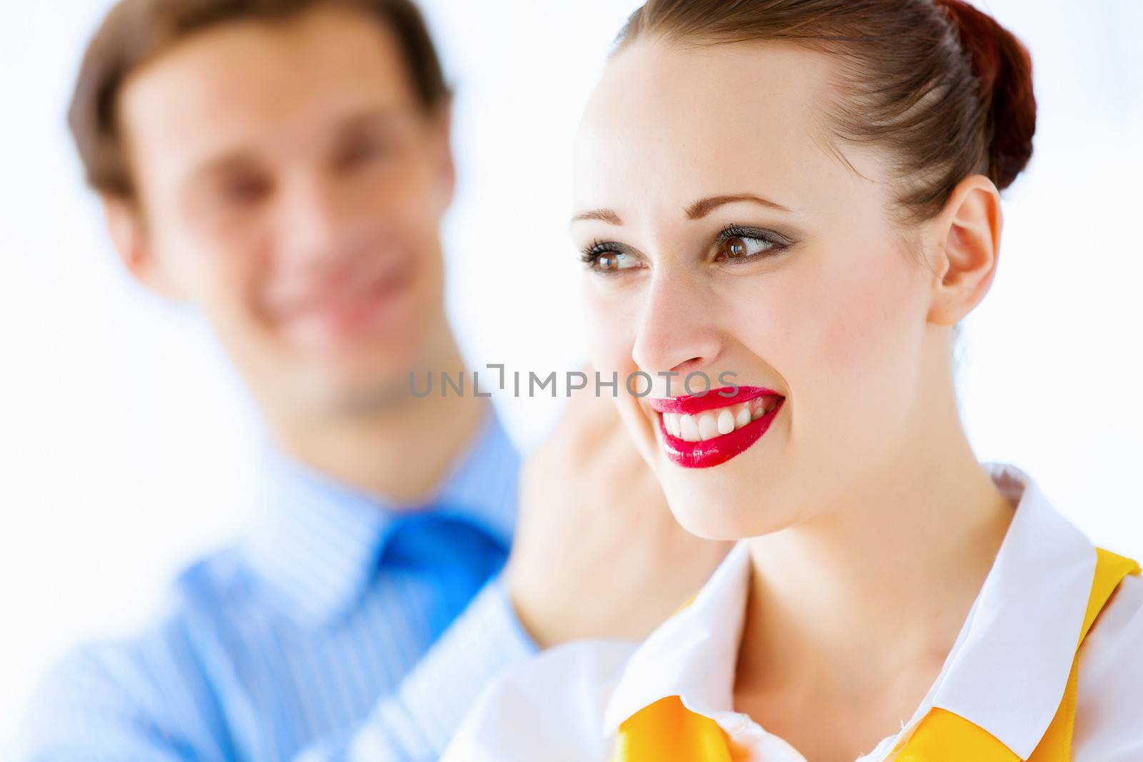 Image of businessman and businesswoman smiling joyfully