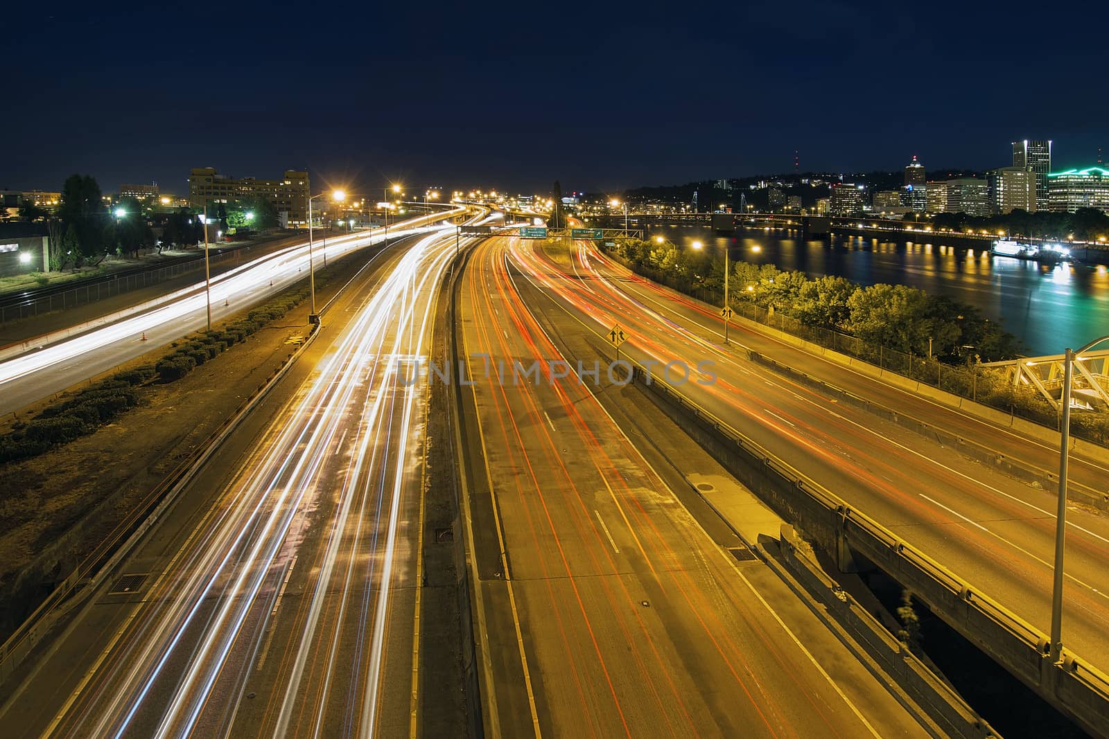 Interstate Freeway Light Trails Through Portland Oregon City Along Willamette River at Night