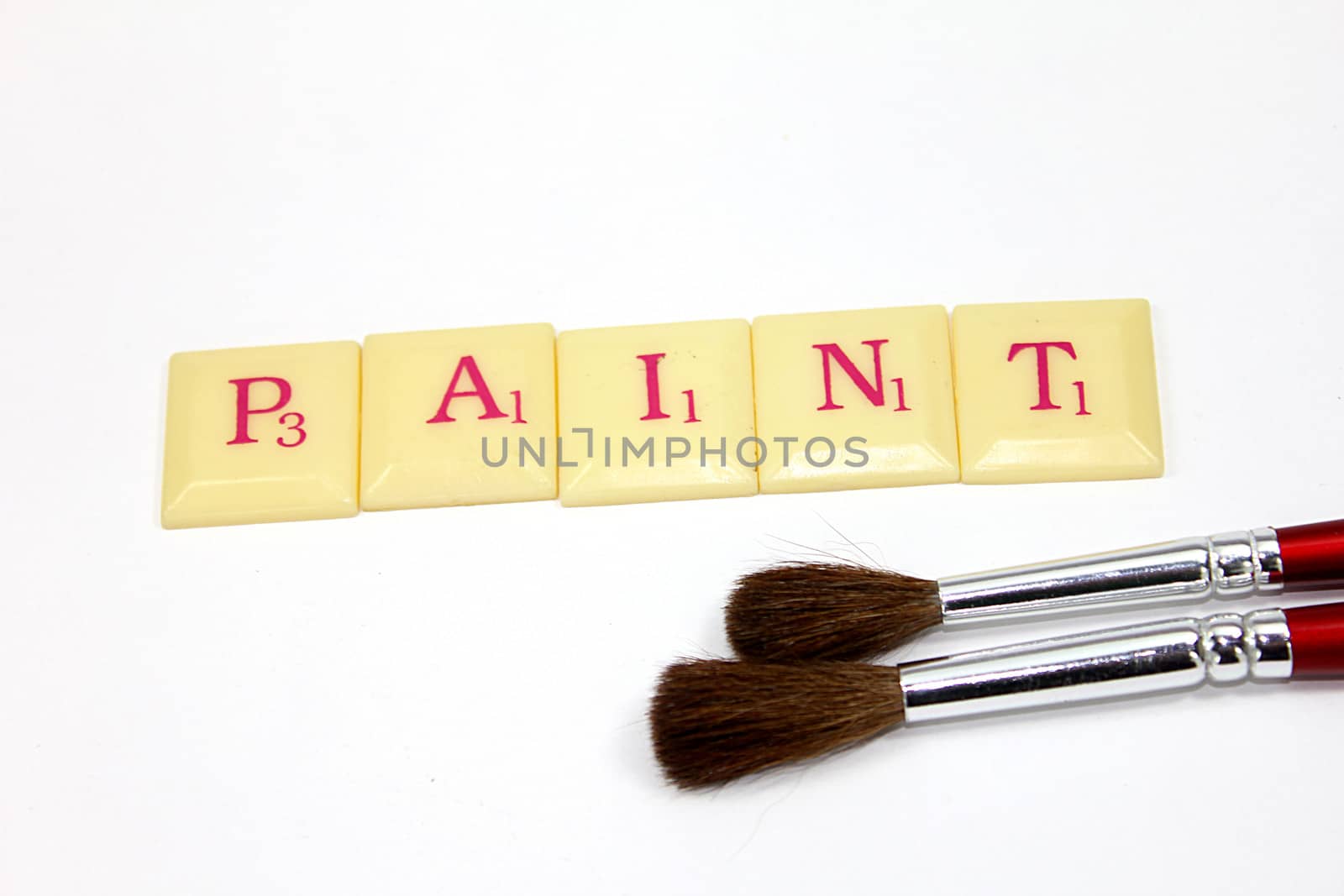 paint word with brushes isolated white background
