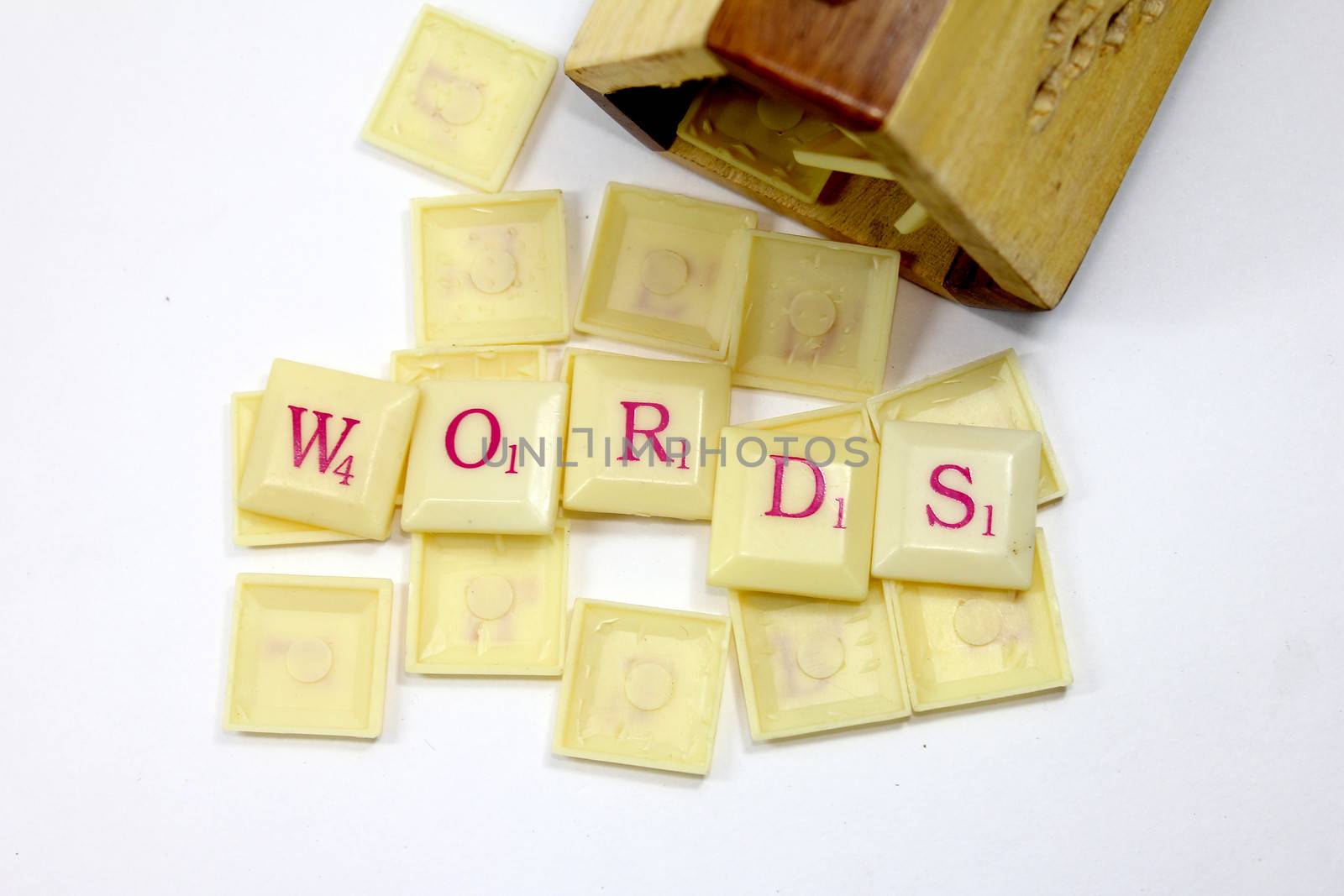 words written with scrabble with wooden stand