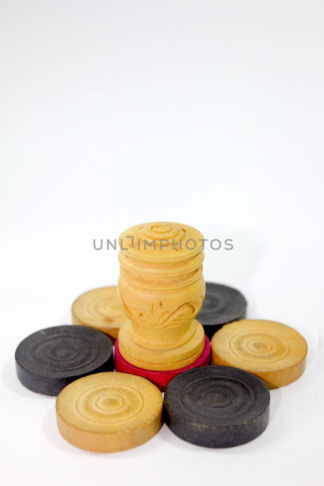 carrom coins with wooden object