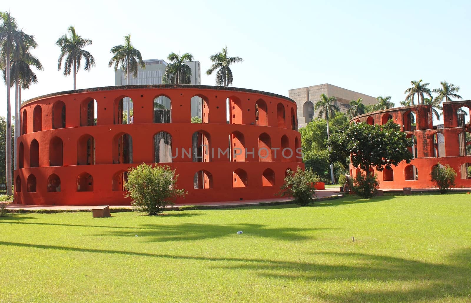 red circular building by motionkarma