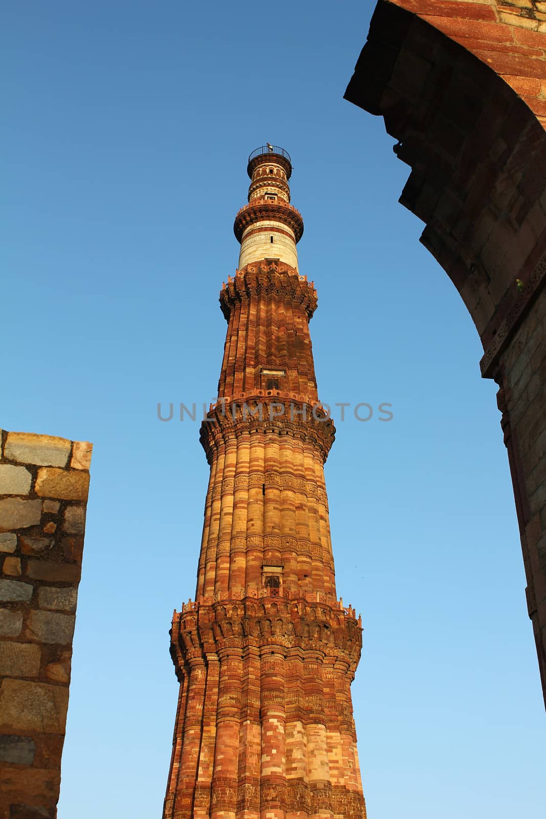 qutub minar with other walls
